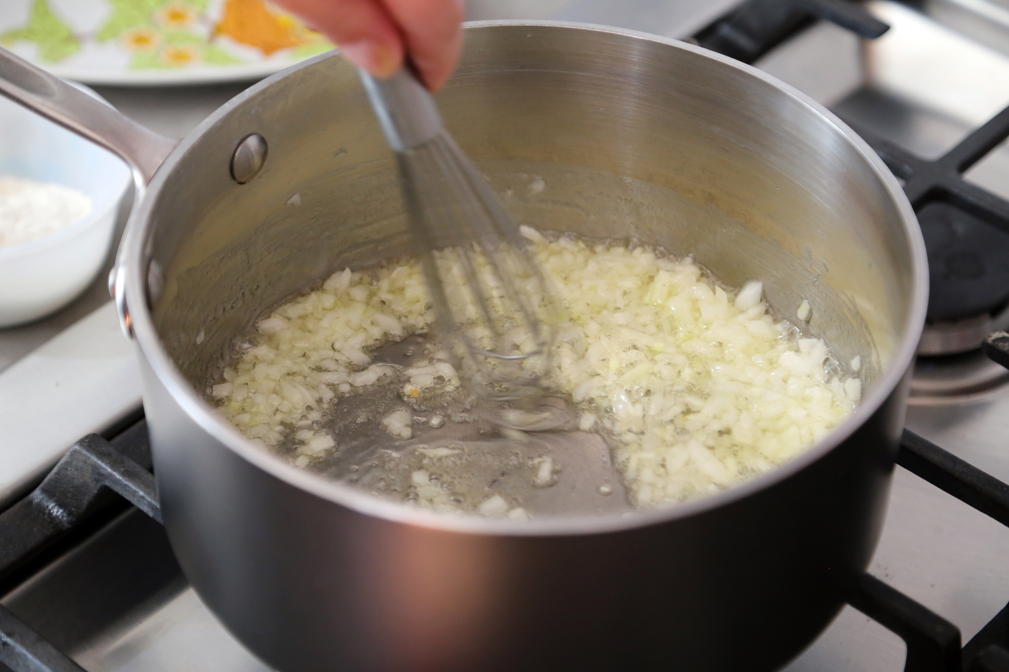 In the same saucepan, melt the butter over medium heat. Add the onion and sauté until tender and golden, about 7 minutes.