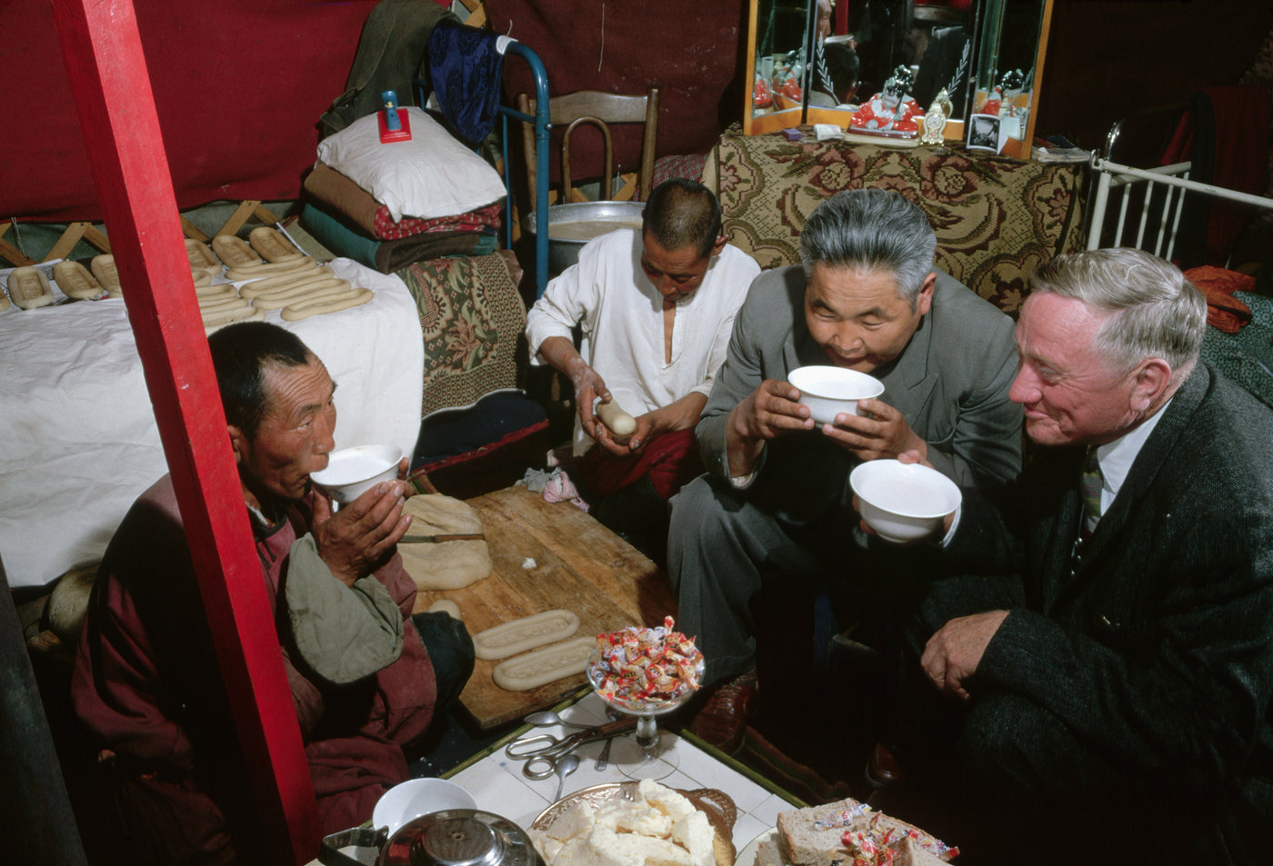 American Supreme Court justice William O. Douglas drinks fermented horse milk with herders in a yurt during his visit to Mongolia in 1961.