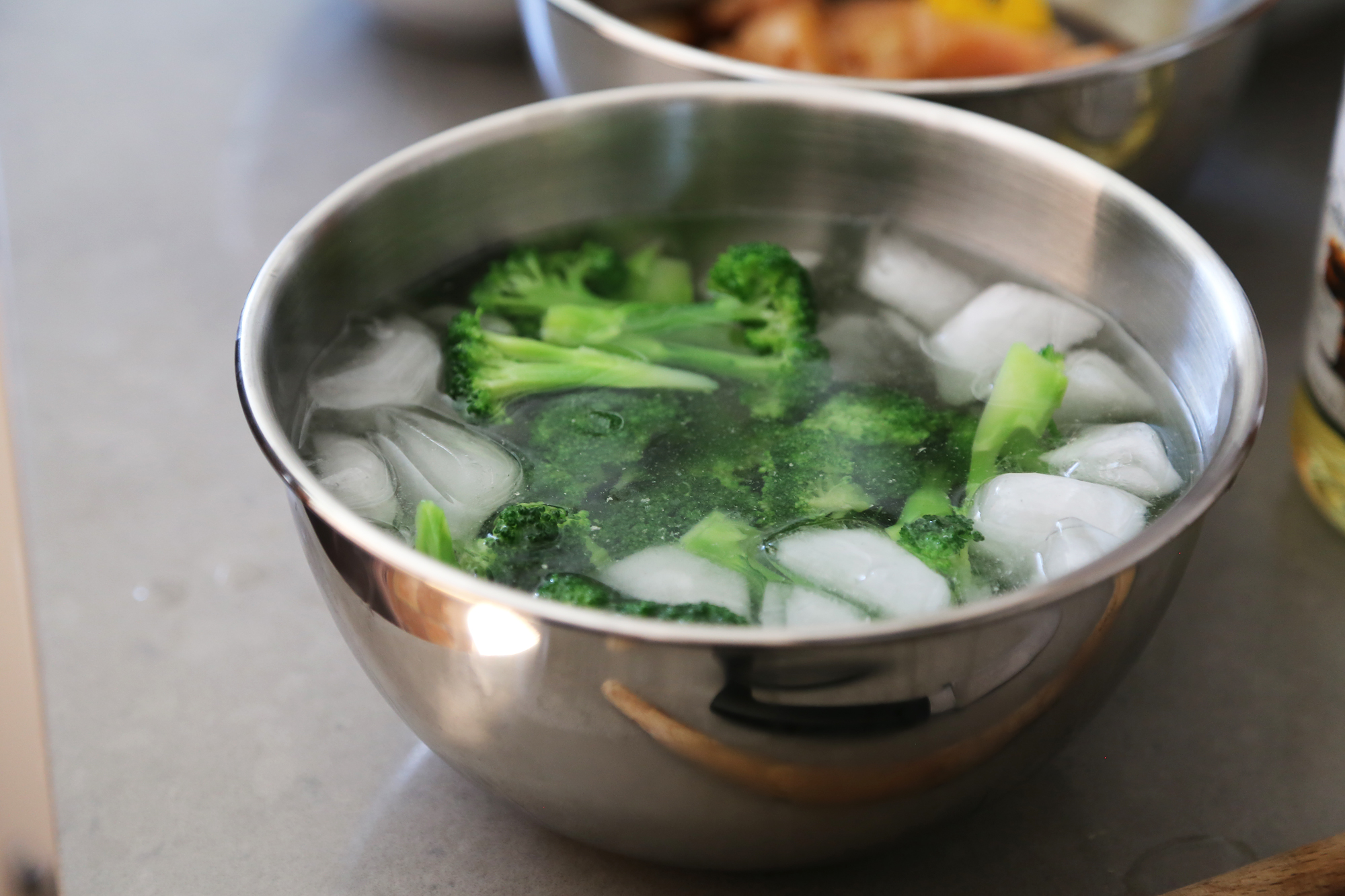 Plunge broccoli in a bowl of ice water to stop the cooking quickly.