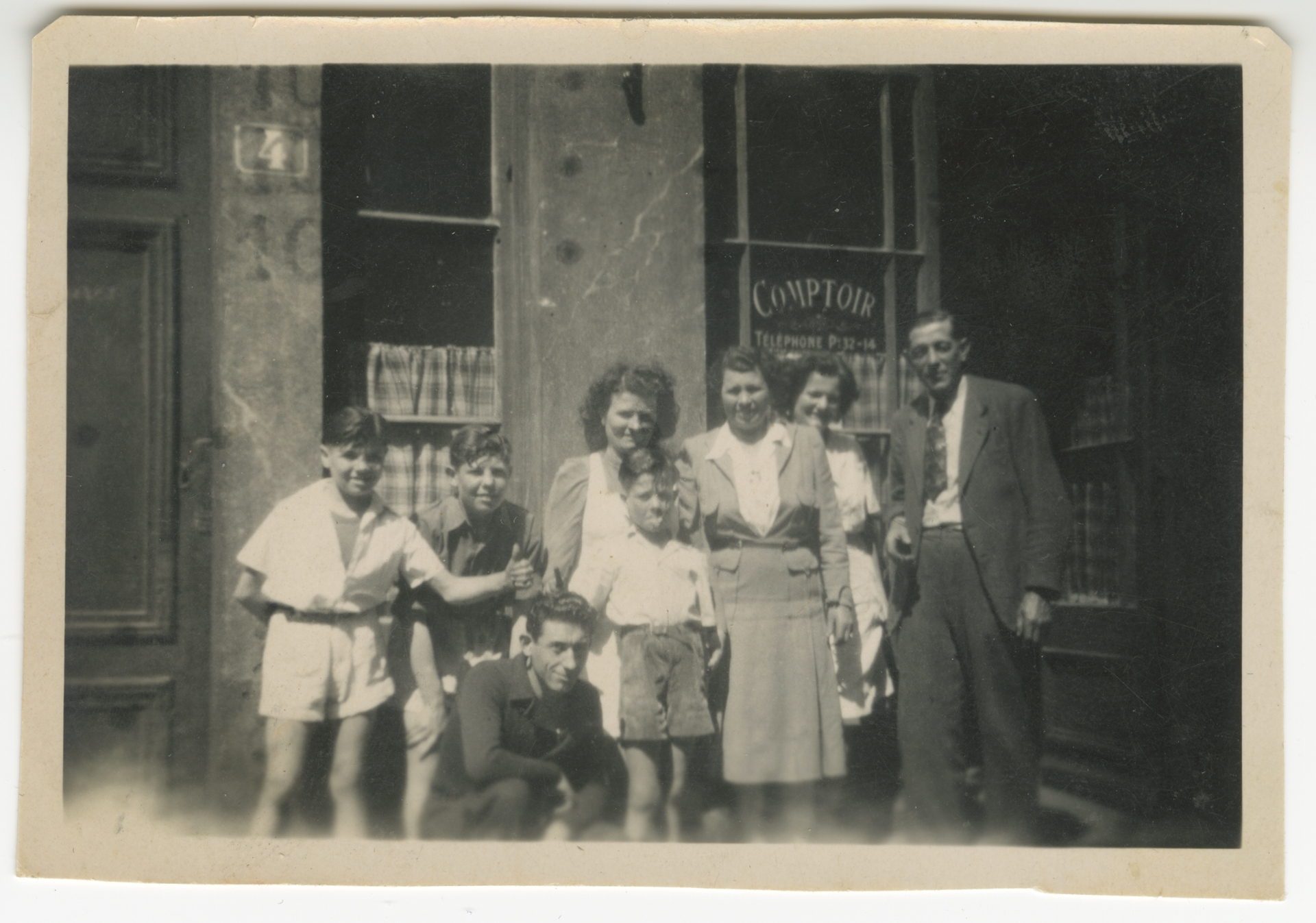 Jacques Pépin (left), his brother Roland, his mother Jeannette, his younger brother Bichon, and aunts and uncles in front of the family restaurant, Chez Pépin.
