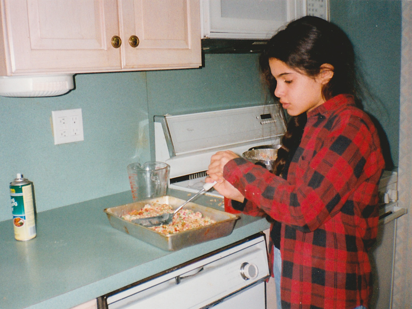 Liz Alpern baking Rice Krispies treats as a child. Alpern was one of the storytellers at Schmaltzy. She says growing up, her Long Island family was not known for cooking. "We made cookies that you sliced and put in the oven. That was baking."