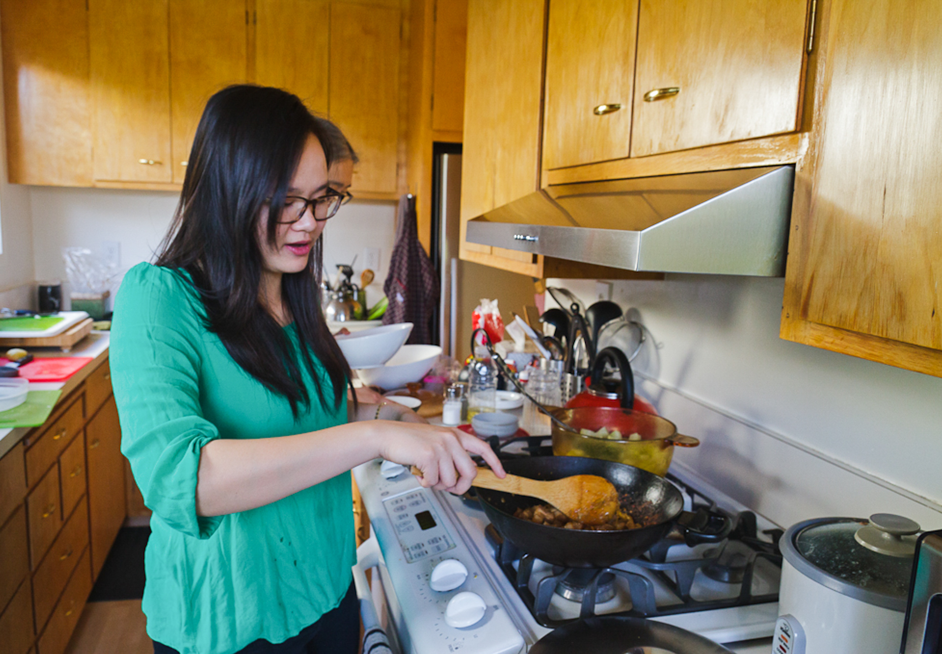 Khanh-Hoa Nguyen cooks caramelized pork belly with ginger, a Cambodian dish served to women who have just given birth.