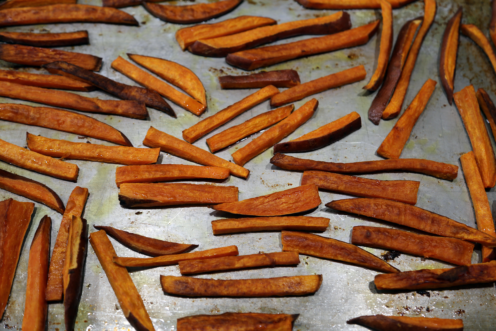 Bake, turning the sweet potatoes once or twice, until tender and golden, about 30 minutes.