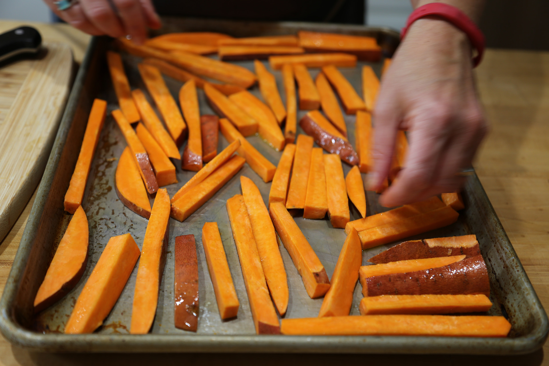 Spread the sweet potatoes out on the baking sheet in an even layer (if they overlap, they will steam and won’t come out as crisp and caramelized).