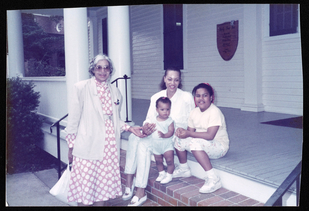 Rosa Parks with her niece Susan McCauley and family outside the Holly Tree Inn in Hampton, Va., 1989