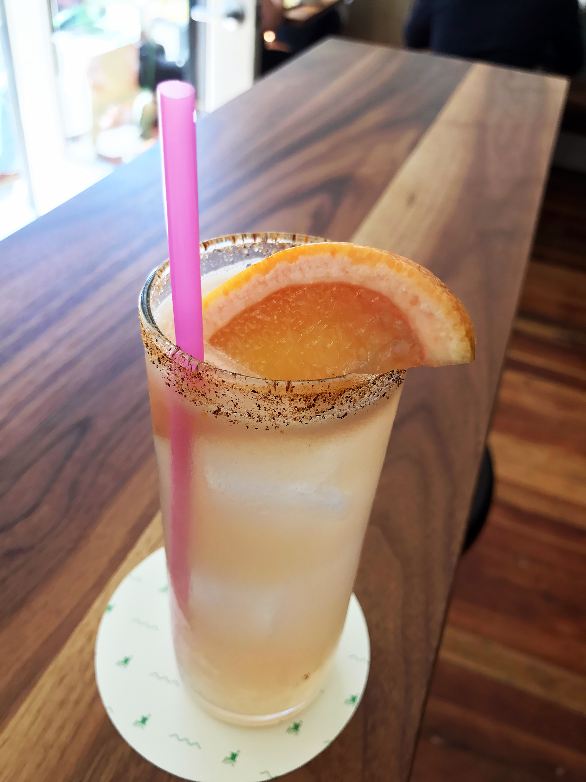 Classic Paloma cocktail with pink grapefruit juice and tequila.