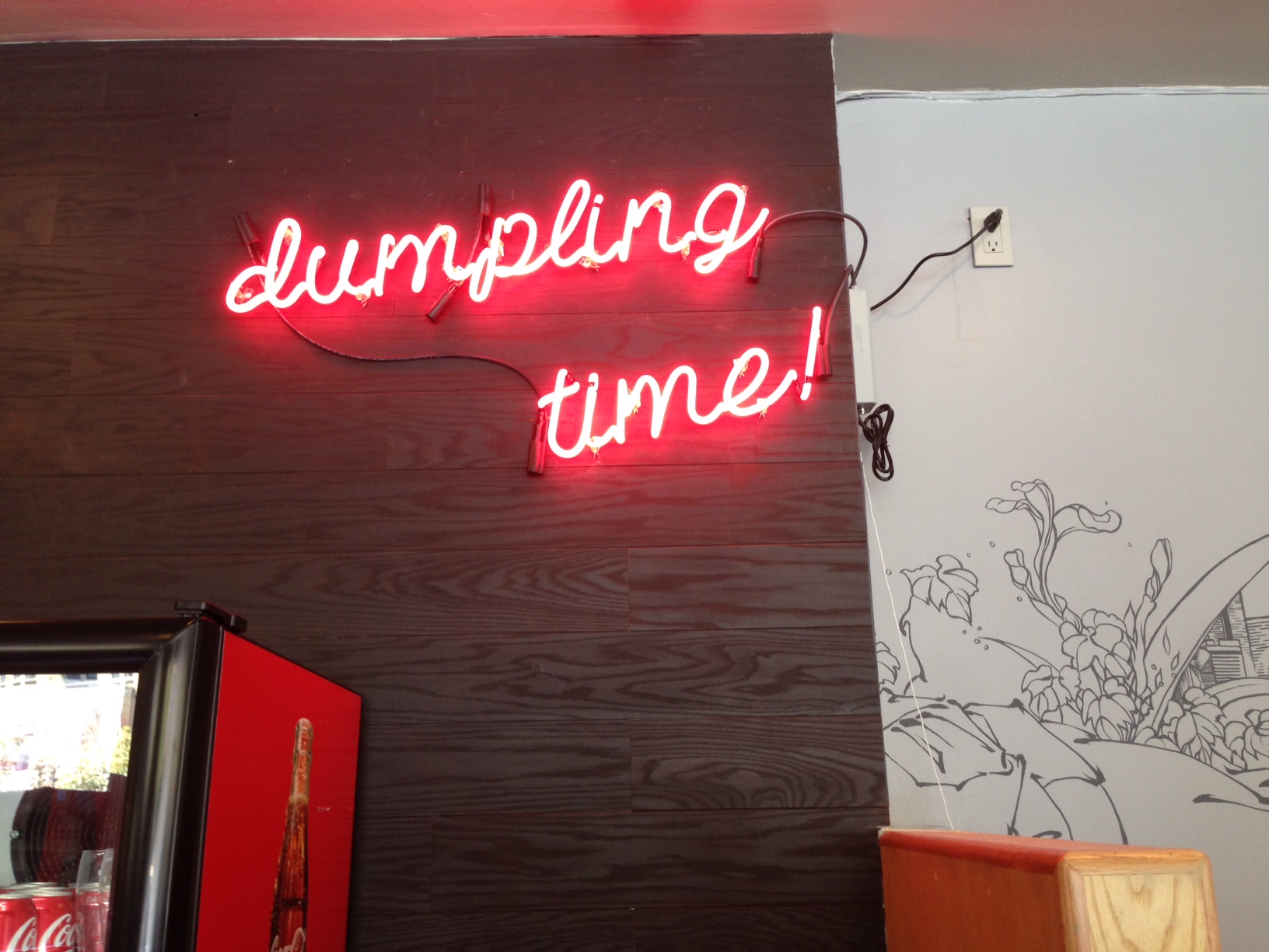 Dumpling Time neon sign.
