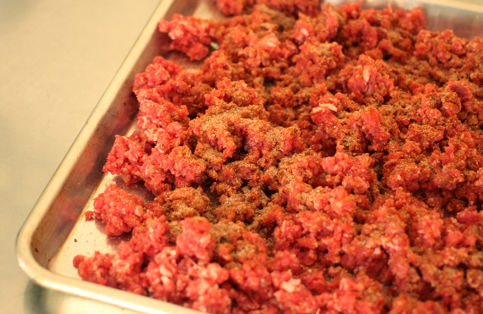 Ground beef with salt, paprika, pepper, garlic powder, and onion powder — no nitrates.