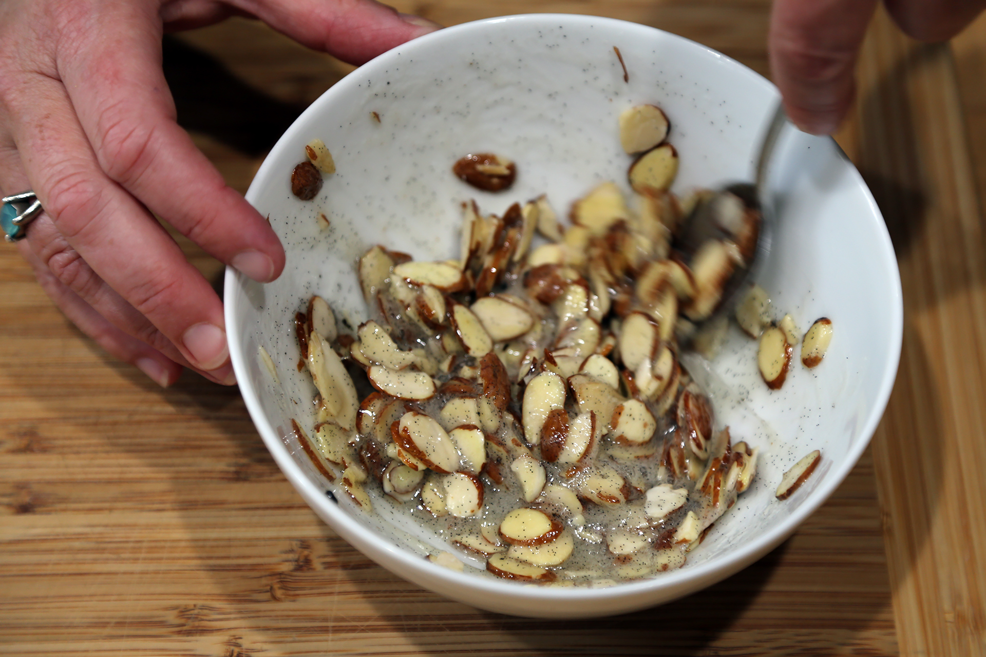 Add the almonds and stir to completely coat. Set aside.