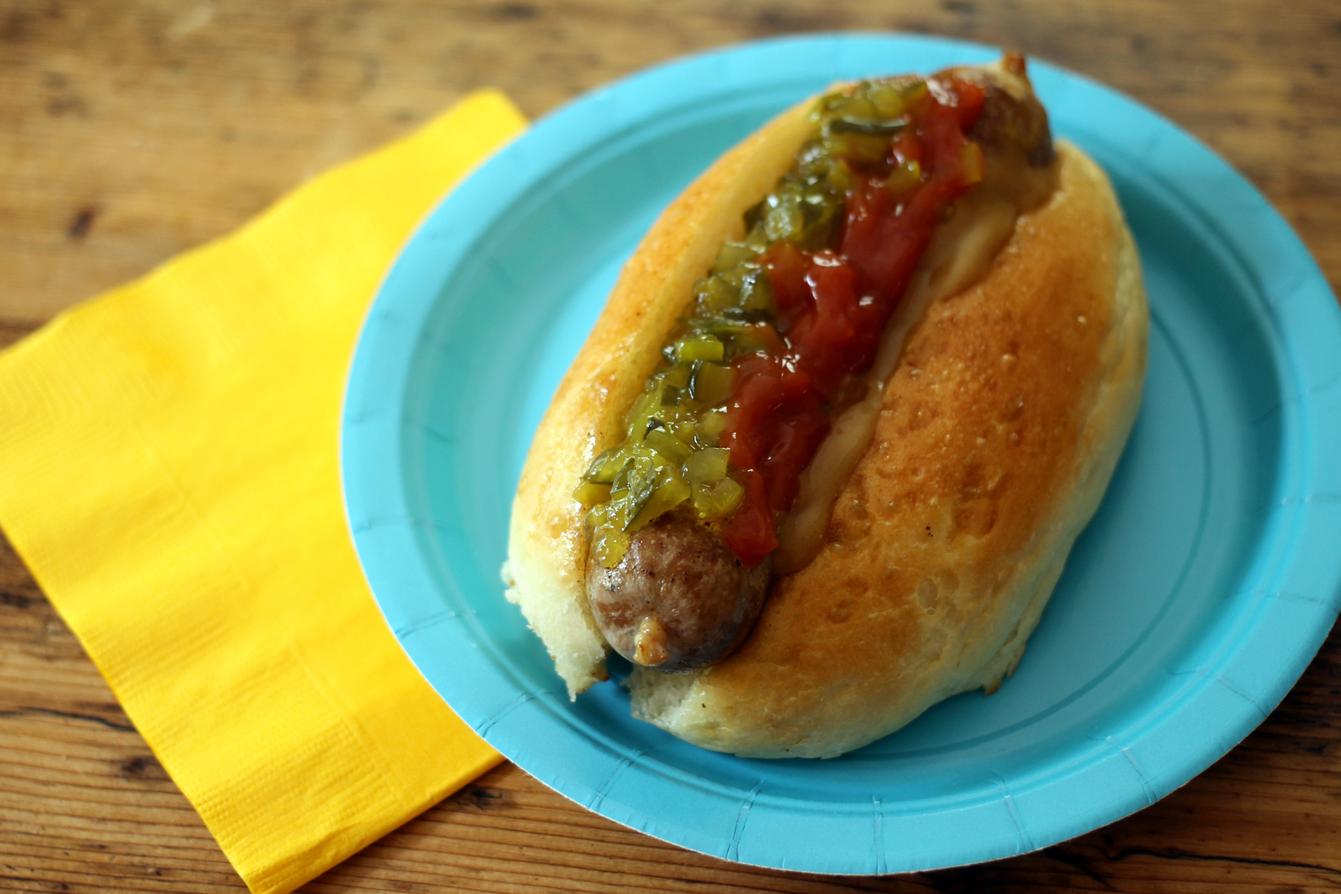 A homemade hot dog in a homemade hot dog bun.