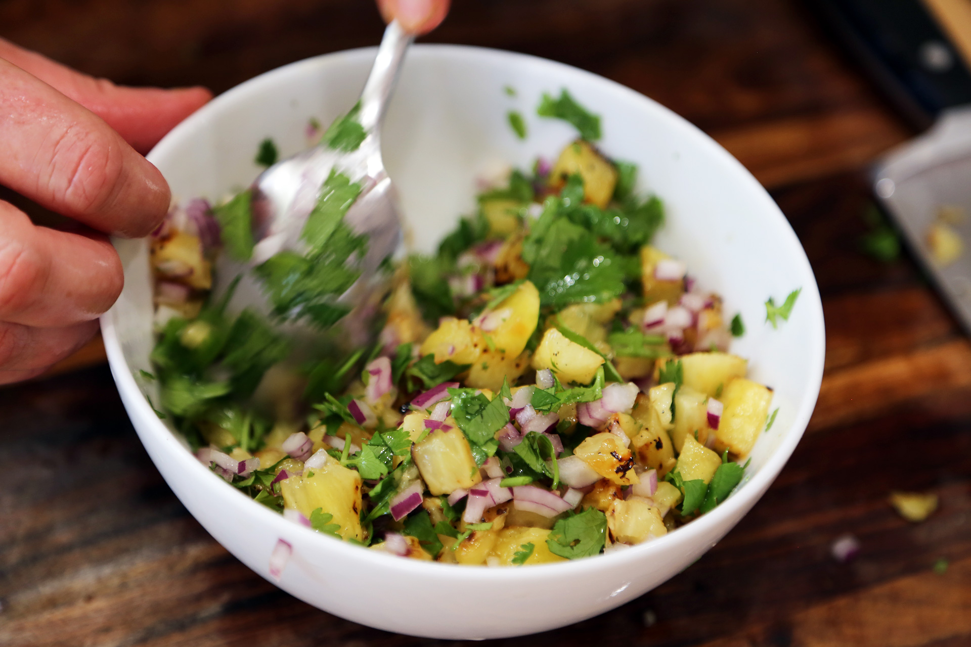 Toss pineapple with the red onion, cilantro, jalapeno if using, and lime juice and set aside.