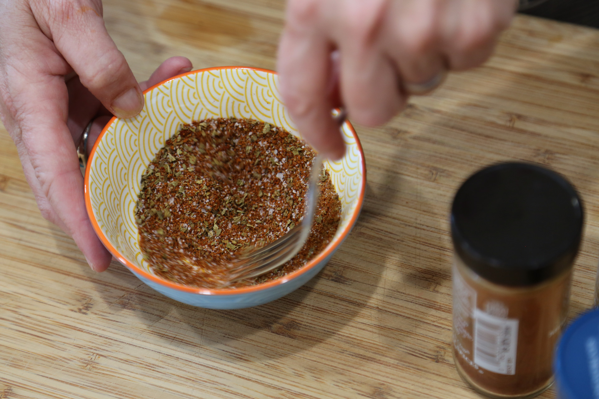 In a bowl, mix together the chili powder, paprika, cumin, oregano, and salt.