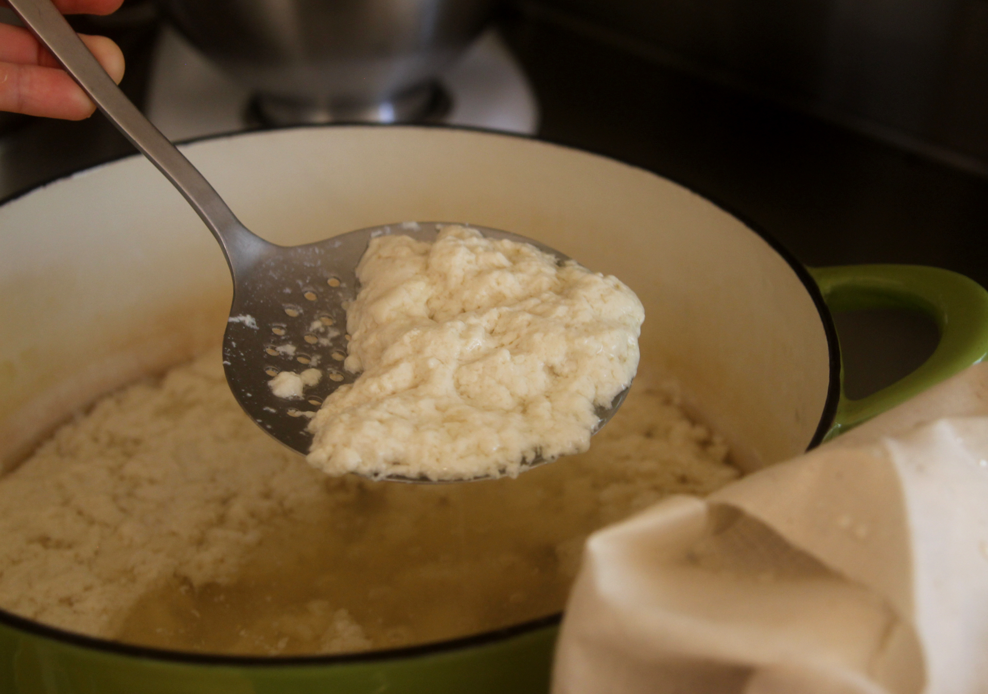 Try to keep the curds in large pieces as you transfer them to the mold.