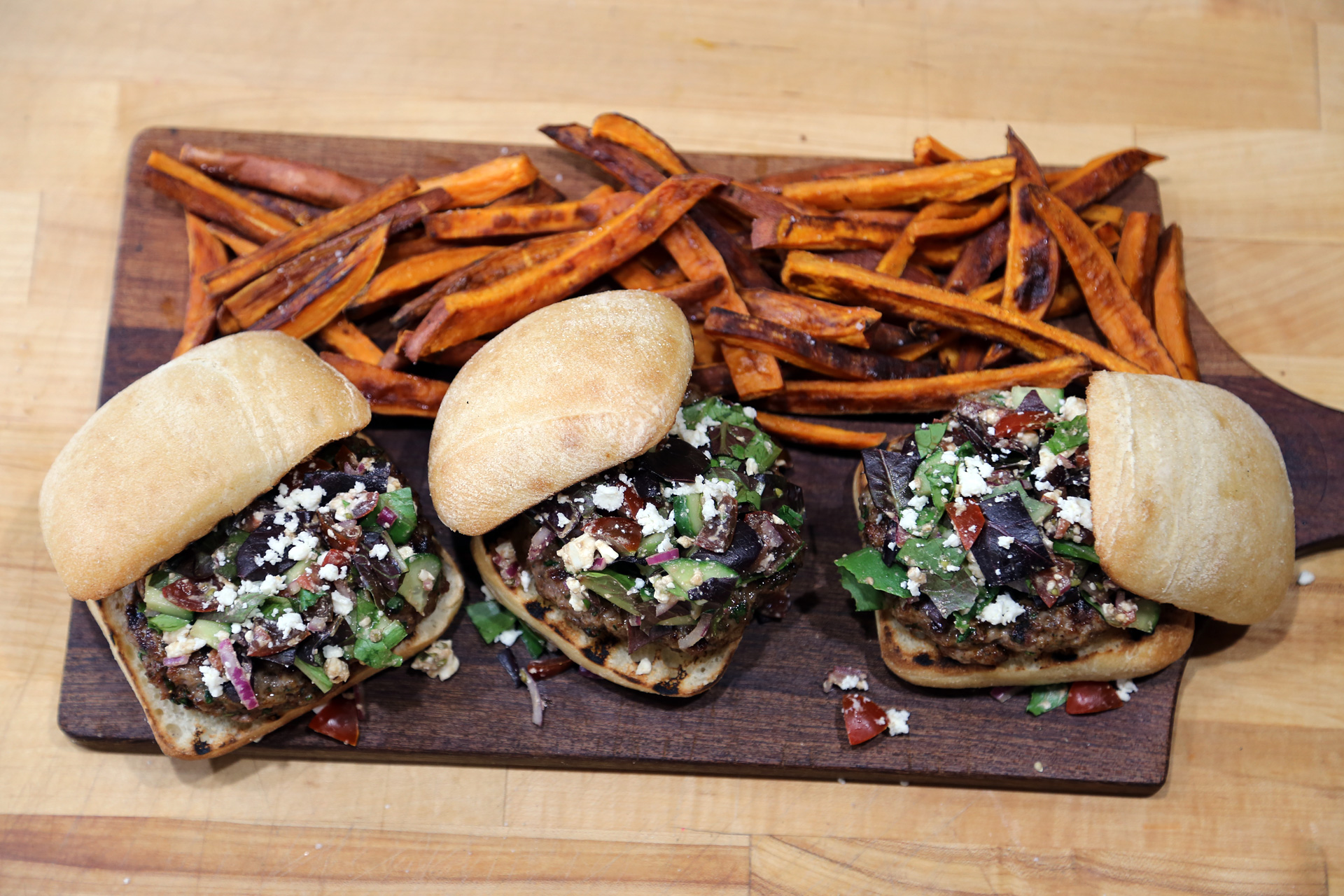 Baked Sweet Potato Fries are a perfect accompaniment to Herbed Lamb Burgers Topped with Chopped Greek Salad.