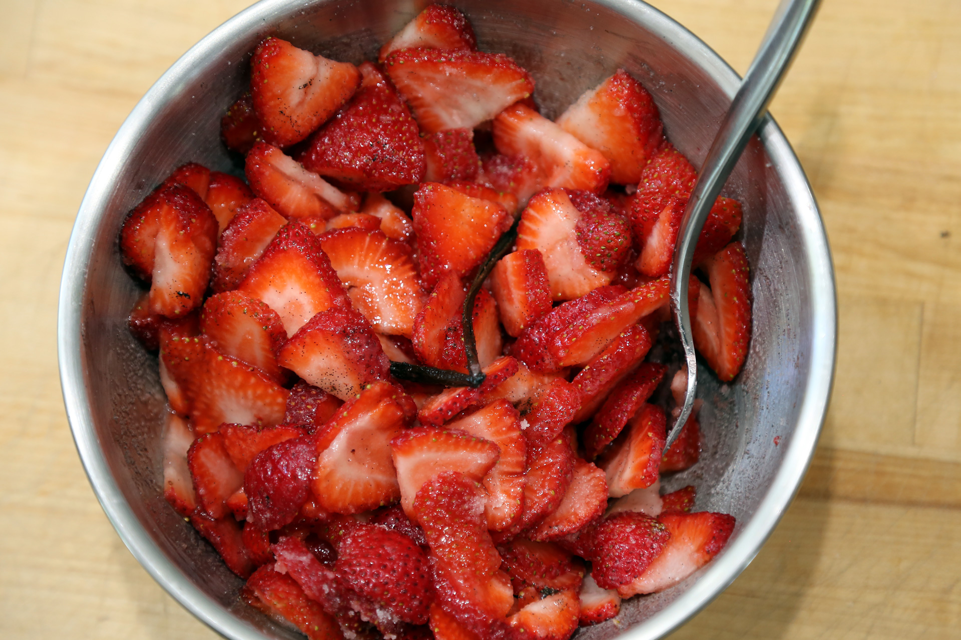 In a bowl, stir together the strawberries, 1/3 cup sugar, and vanilla bean seeds and pod.