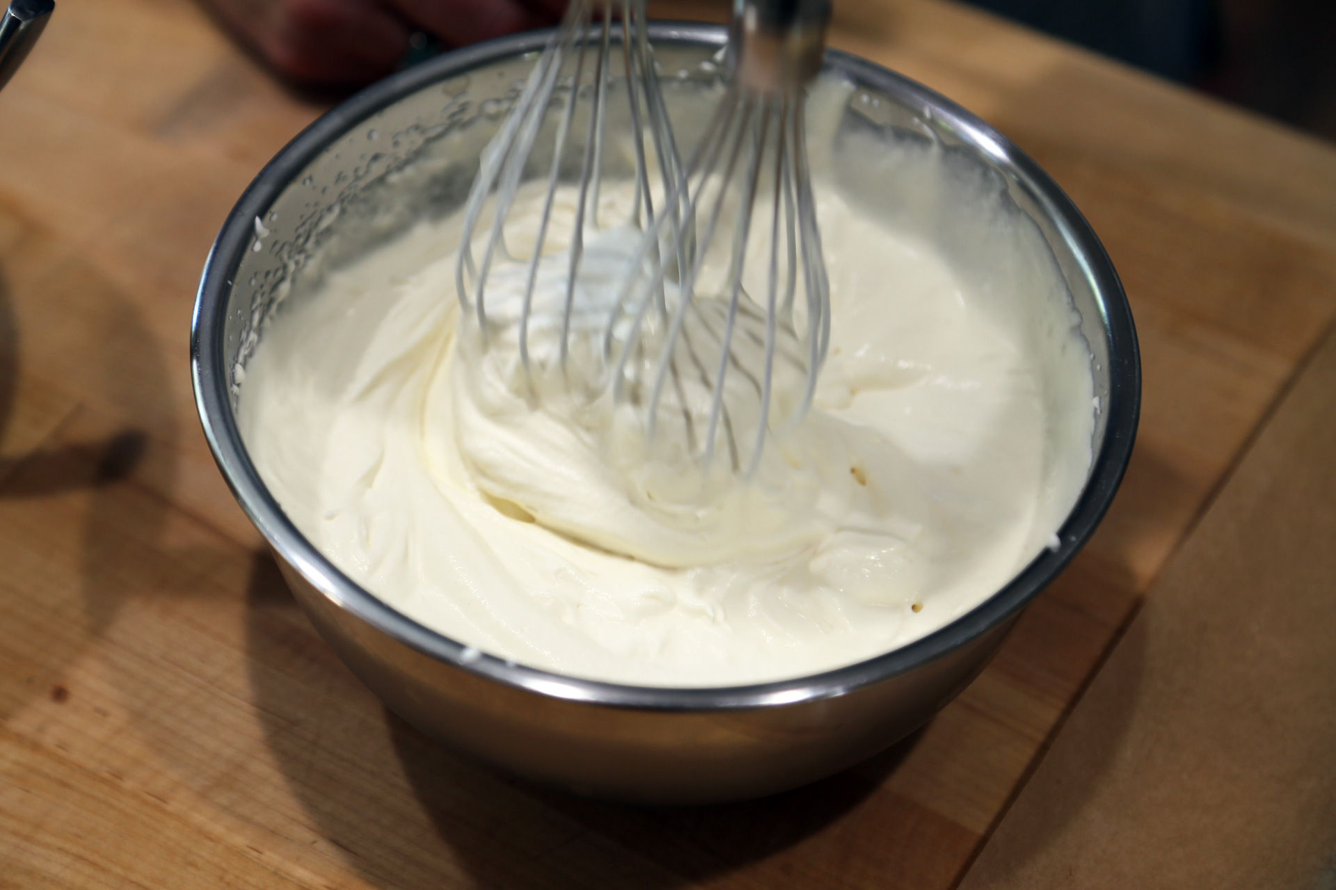 In the bowl of a mixer using a whisk attachment (or using a handheld whisk), beat the cream, 1/4 cup sugar, and vanilla extract until thick and billowy.