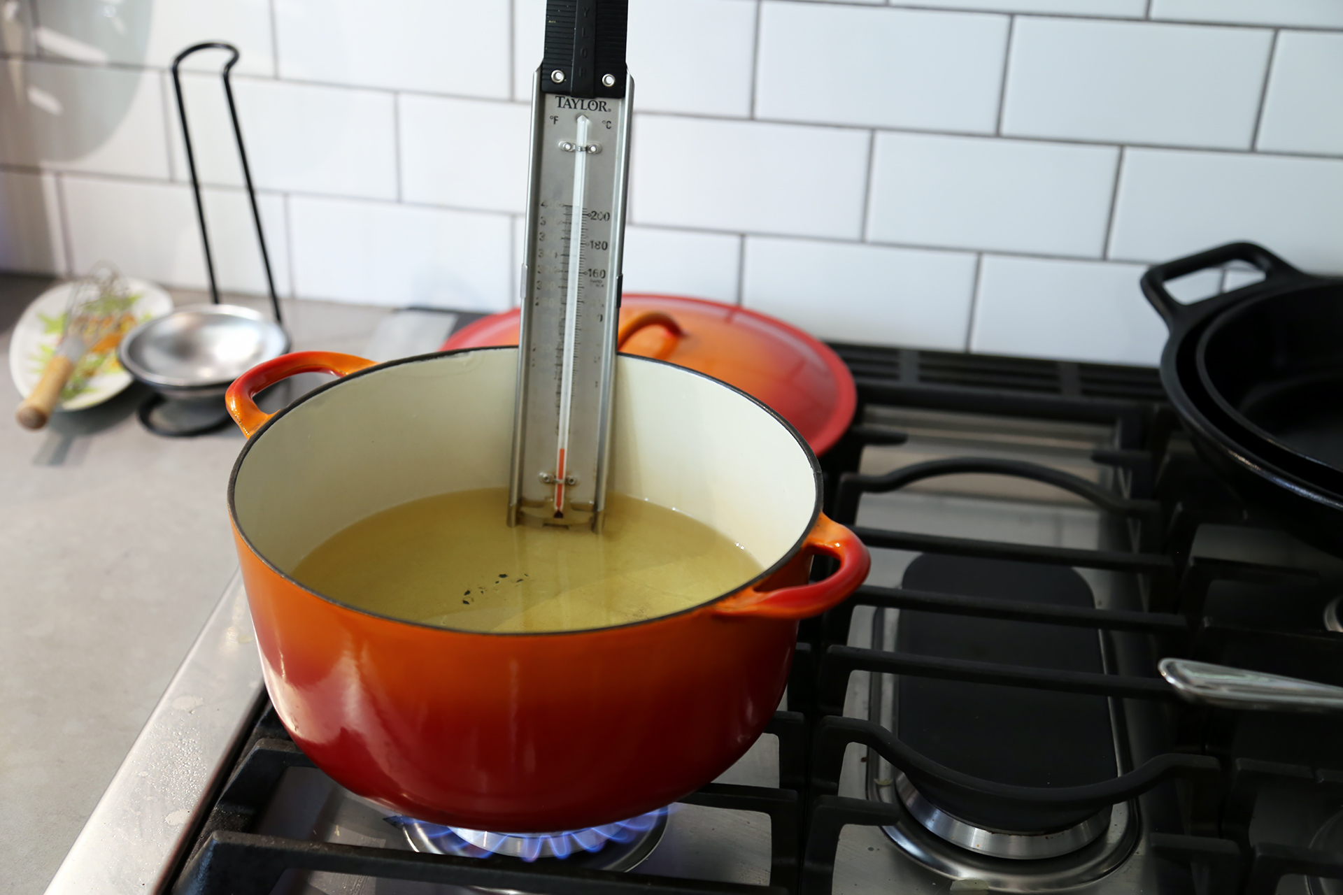 Fill a Dutch oven or large, wide saucepan half full with the oil and heat over medium-high heat to 330F on a deep-fry or candy thermometer.
