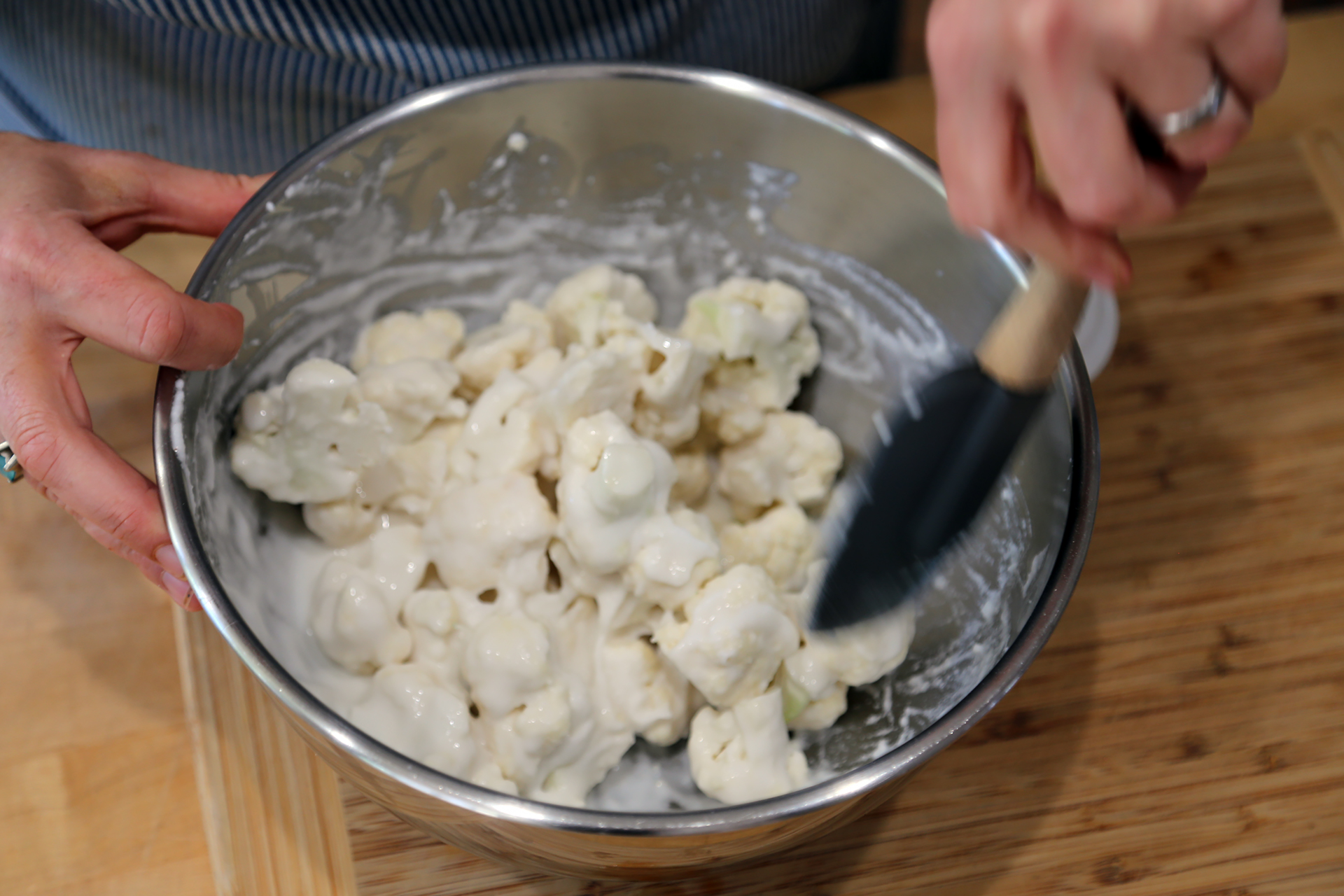 Drop the cauliflower florets into the batter and toss to combine, until each floret is coated with batter.