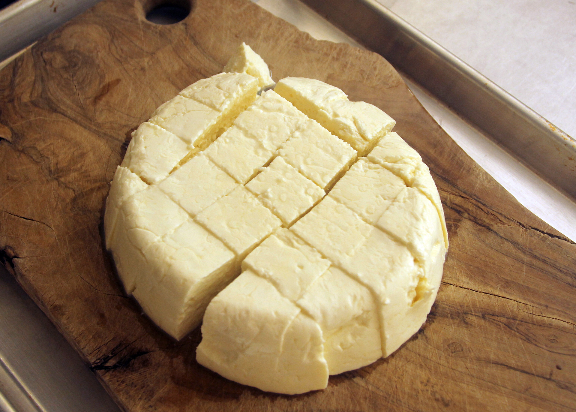 Cut the set curd into a grid of 1- to 1 ½-inch cubes.