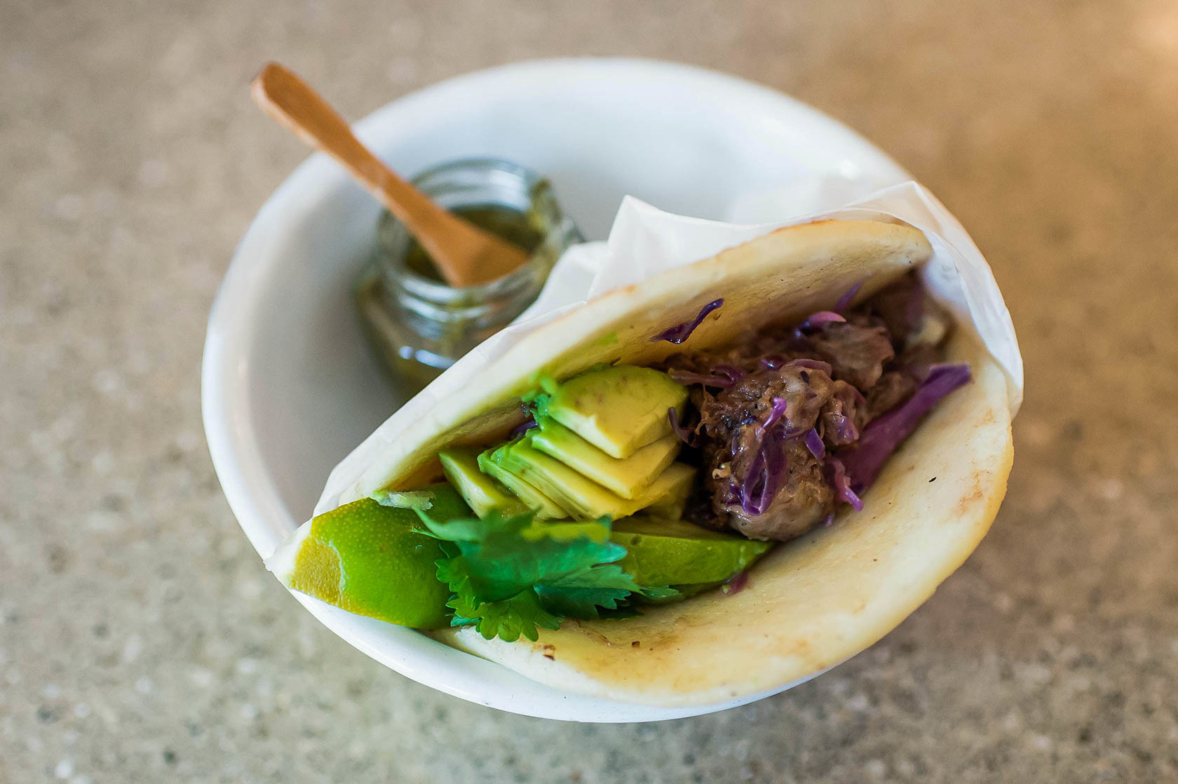 Beef and avocado are among the arepa fillings offered at The Royal. Filling options may vary by region, but the arepa itself remains constant.