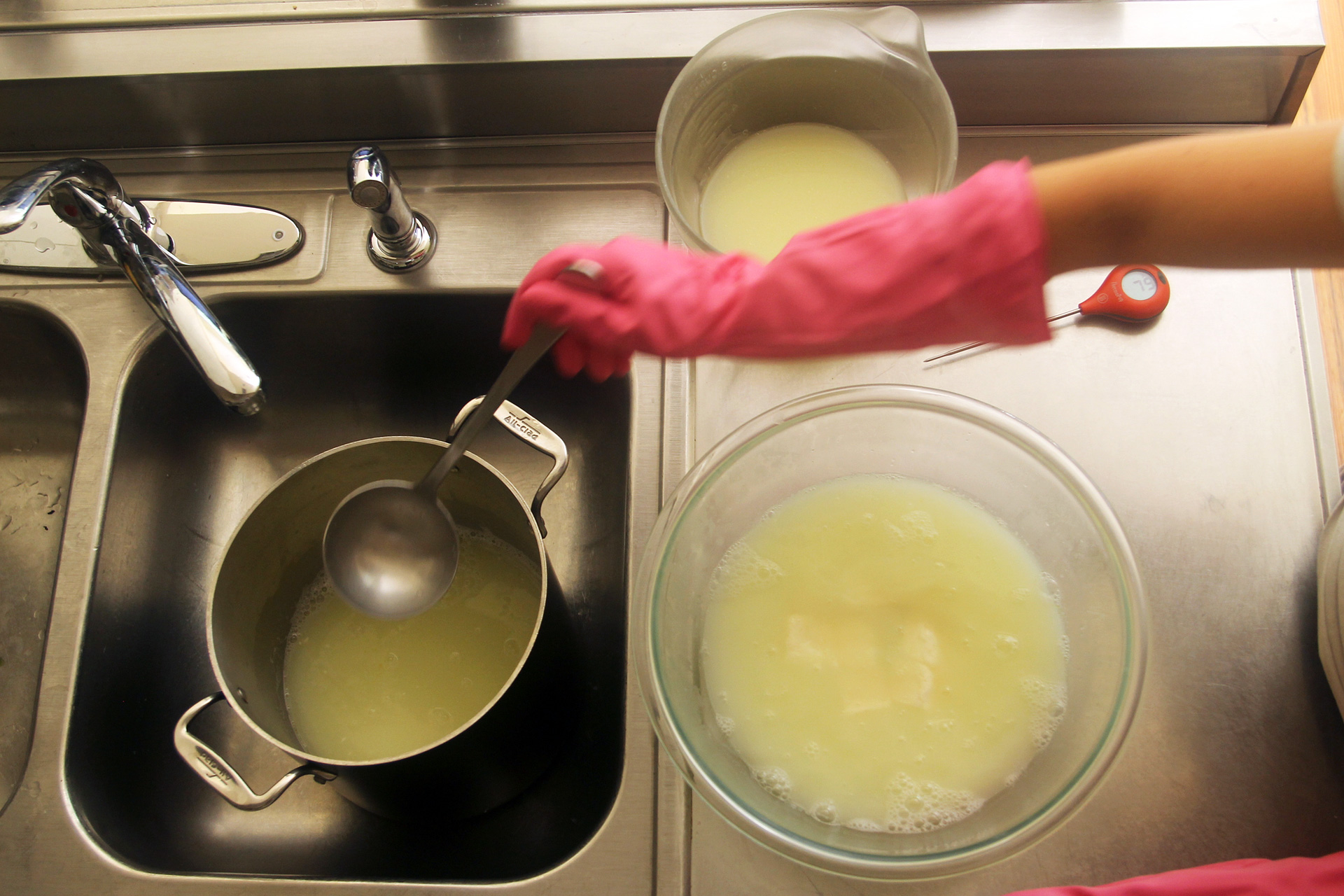 Clockwise, from left: Hot whey, room temperature whey, and mozzarella curds covered in hot whey.