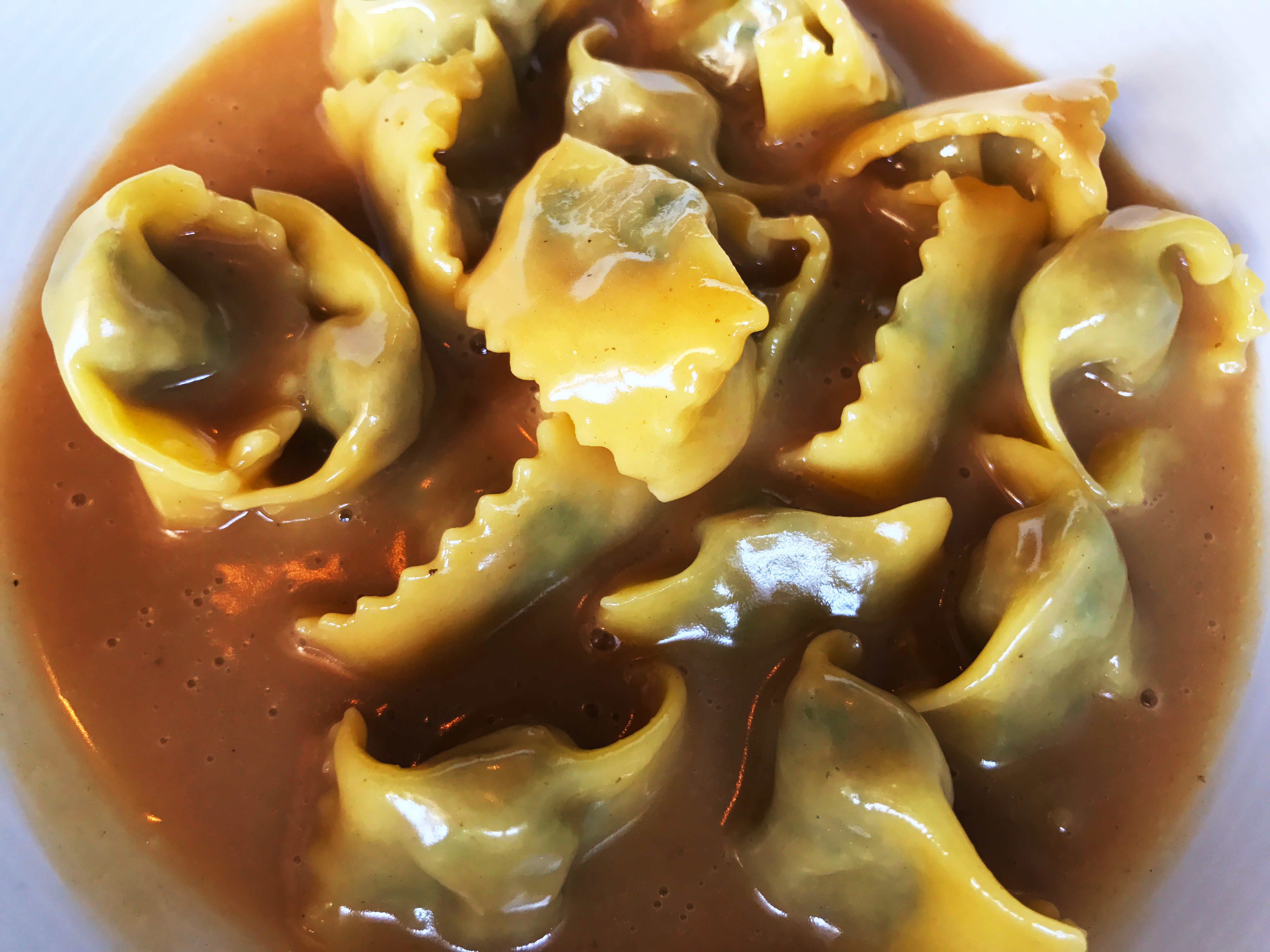 Agnolotti di Lidia, stuffed with a blend of meats in a rich beef reduction sauce.