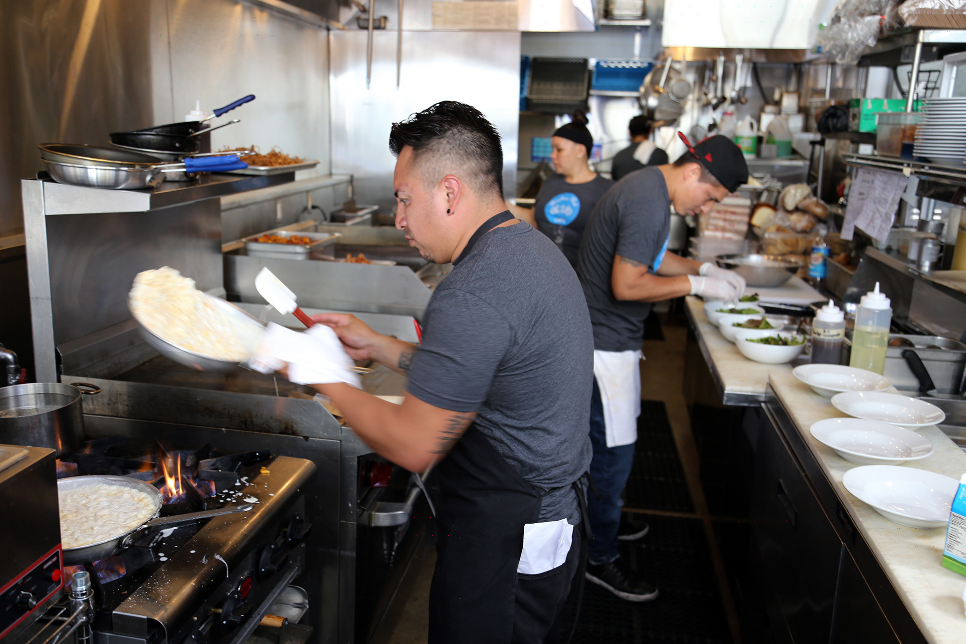 Lead chef Edwin Che and his crew in the back kitchen at Paradise Park Café