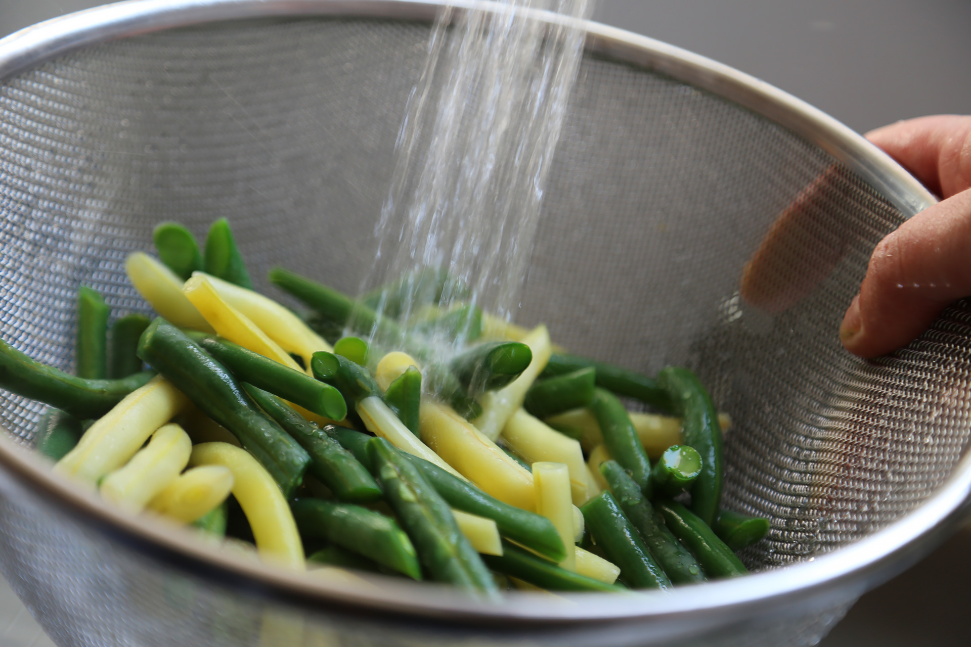 Cook green beans until just crisp-tender, then drain in a colander.