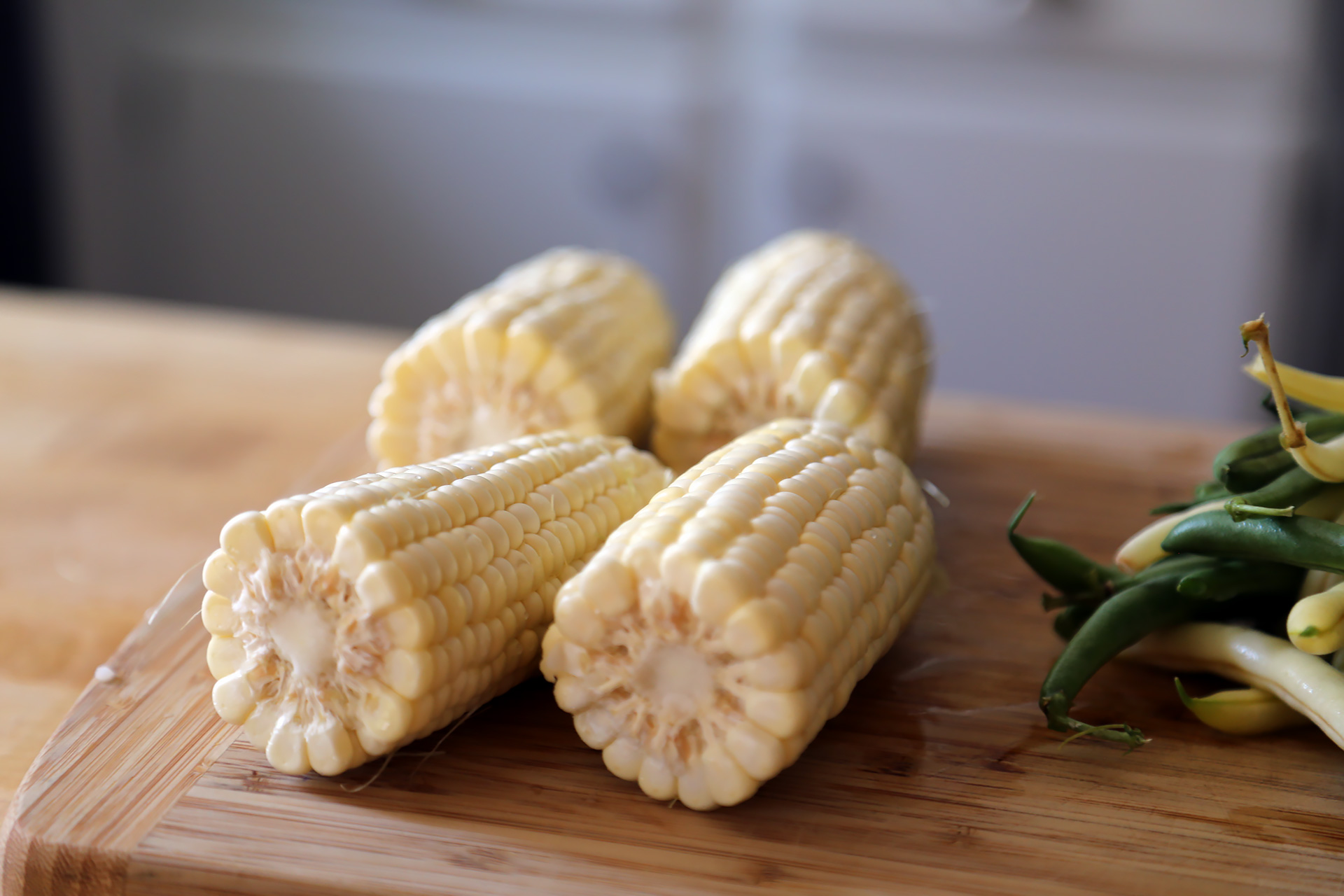 To cut the kernels off the cob, snap or cut the cob in half crosswise.