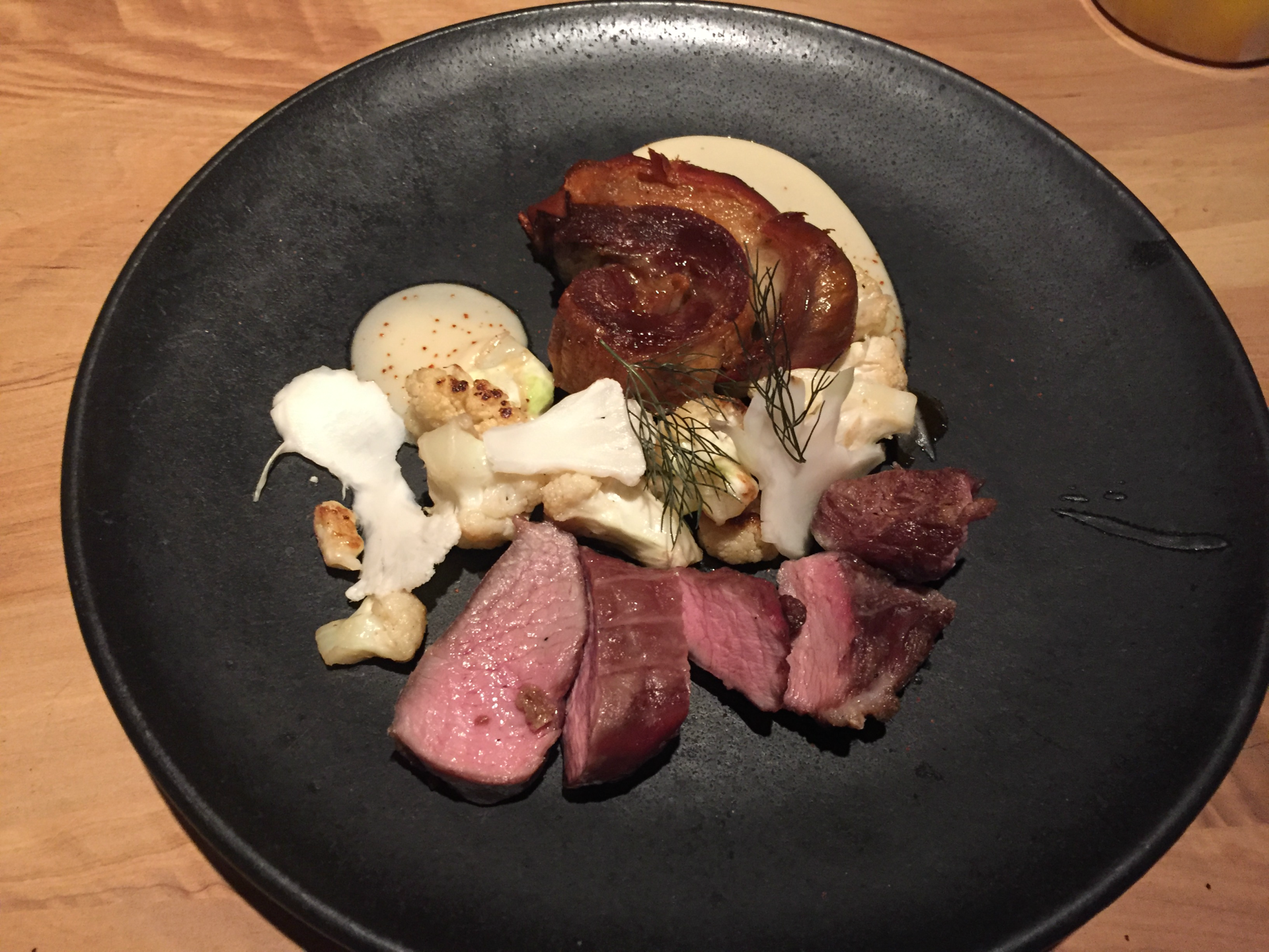 The lamb and cauliflower entree included a surcharge to "reflect the true cost of beef and lamb."