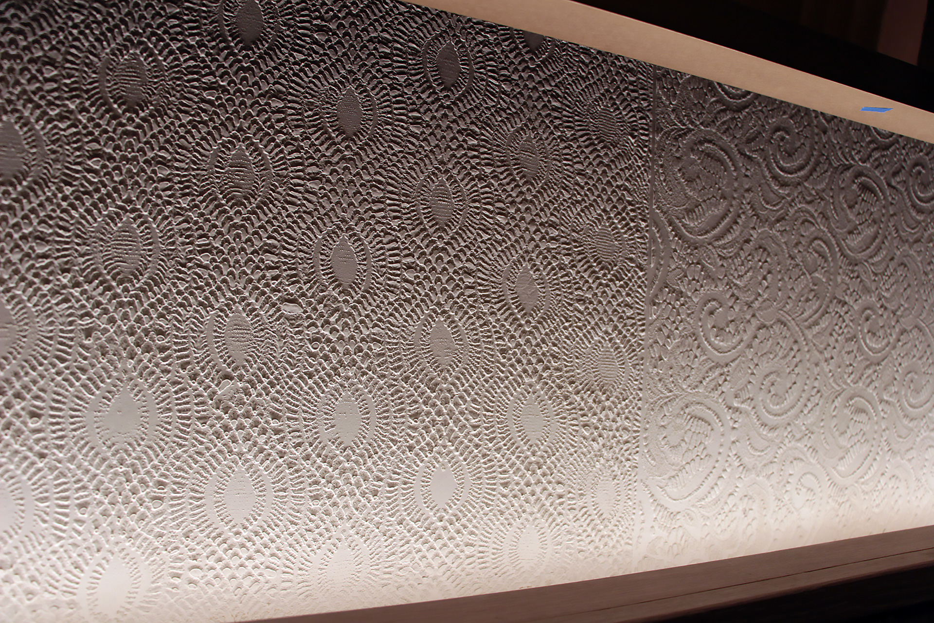 Textured walls were made using fabric from antique Chinese wedding dresses.