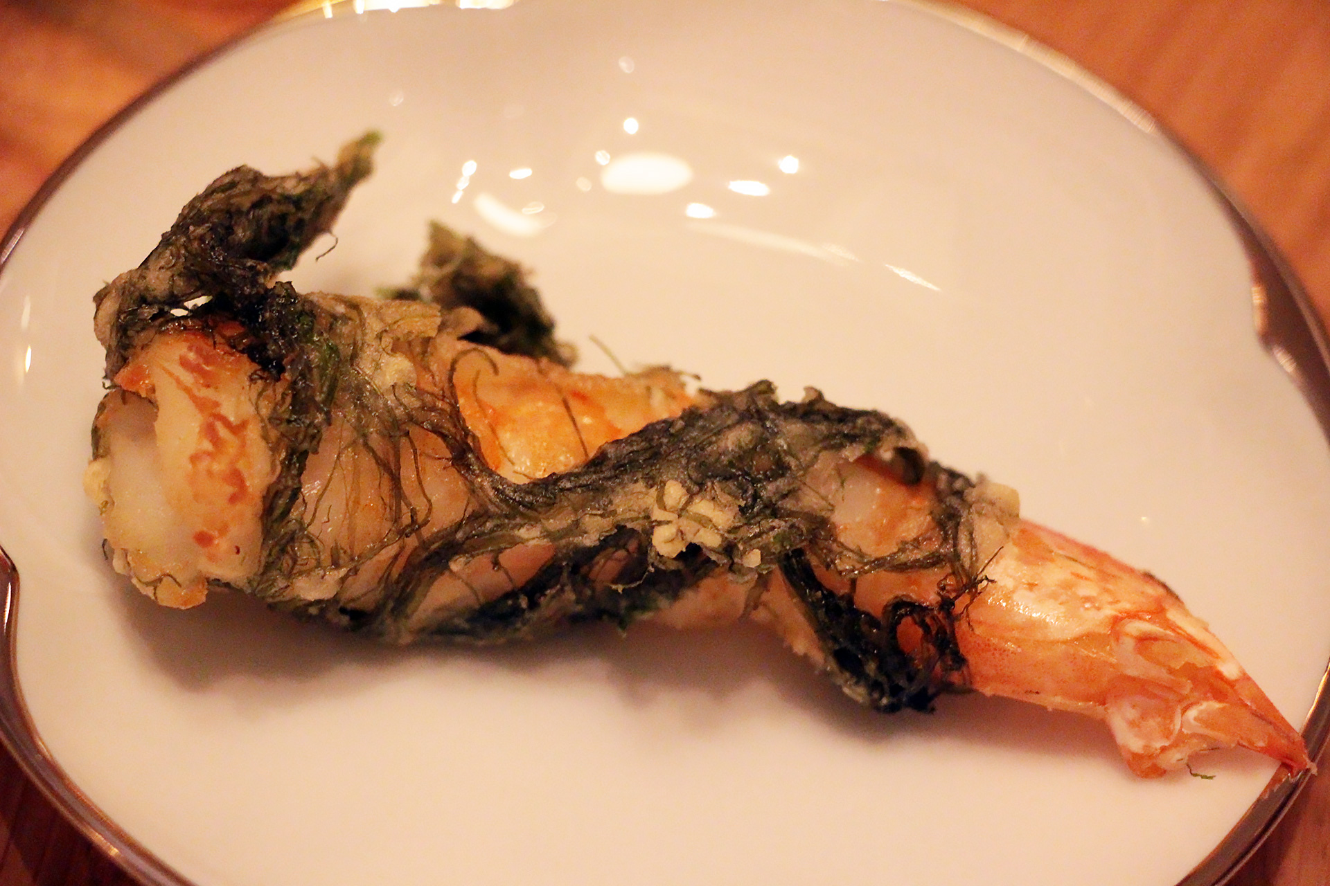 Fried shrimp wrapped in sea grass.