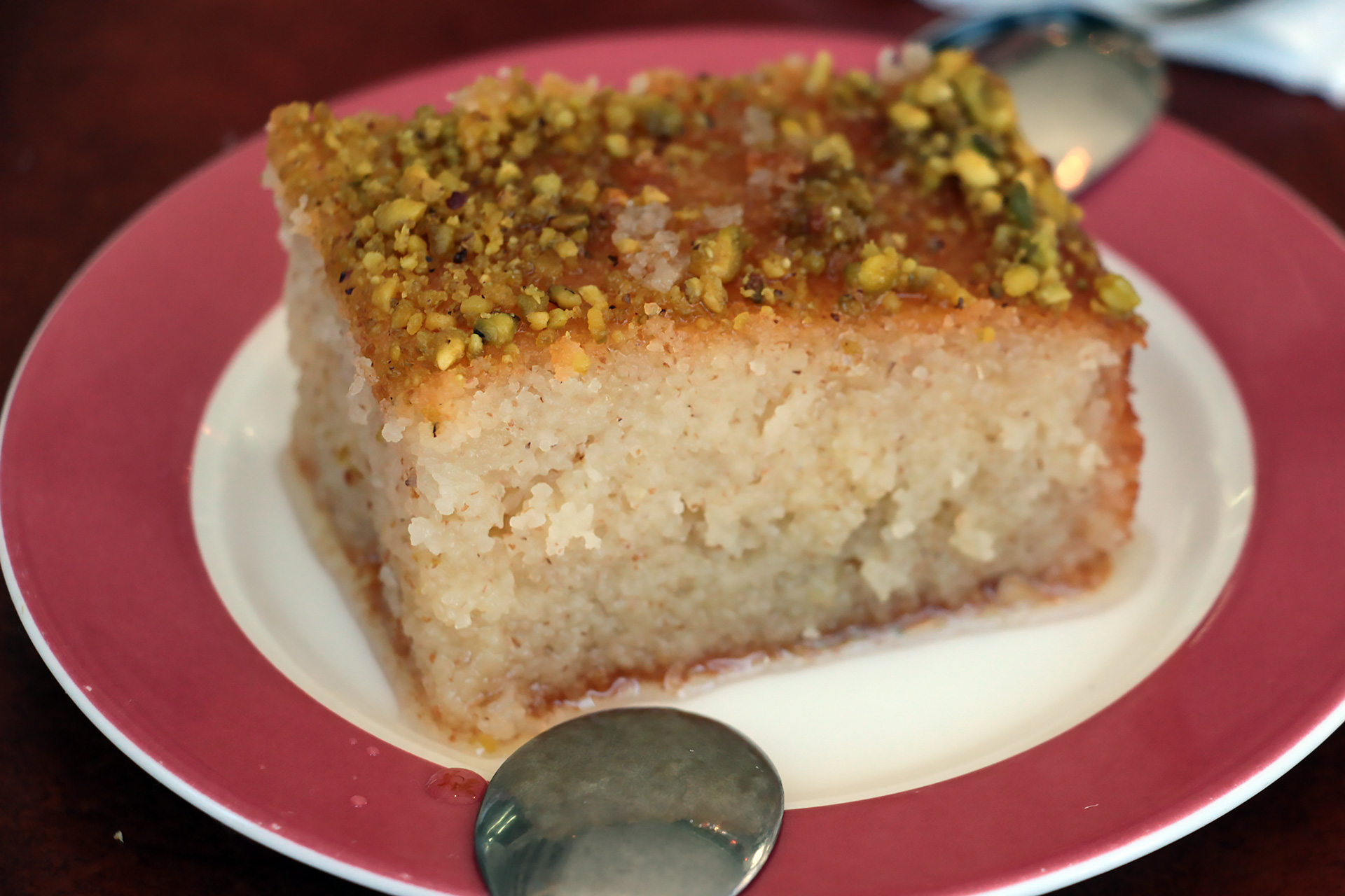 The dessert is called <em>basboussa</em>, an orange blossom water spiked semolina cake topped with pistachios that ultimately tastes like a floral-tinged baklava with the texture of a syrup-soaked Belgian waffle.