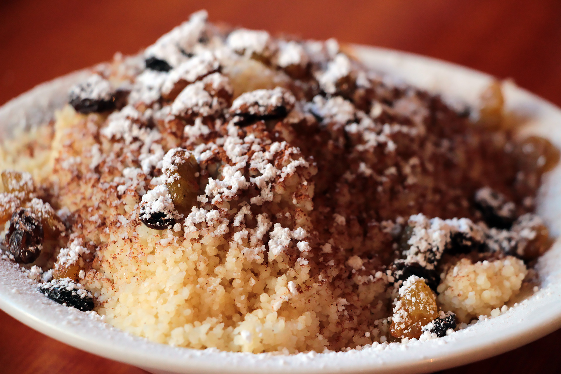 Cinnamon and sugar dusted couscous with regular and golden raisins.
