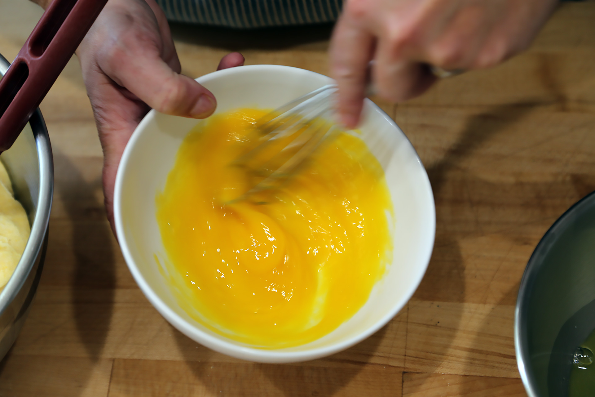 In a bowl, whisk together the egg yolks.