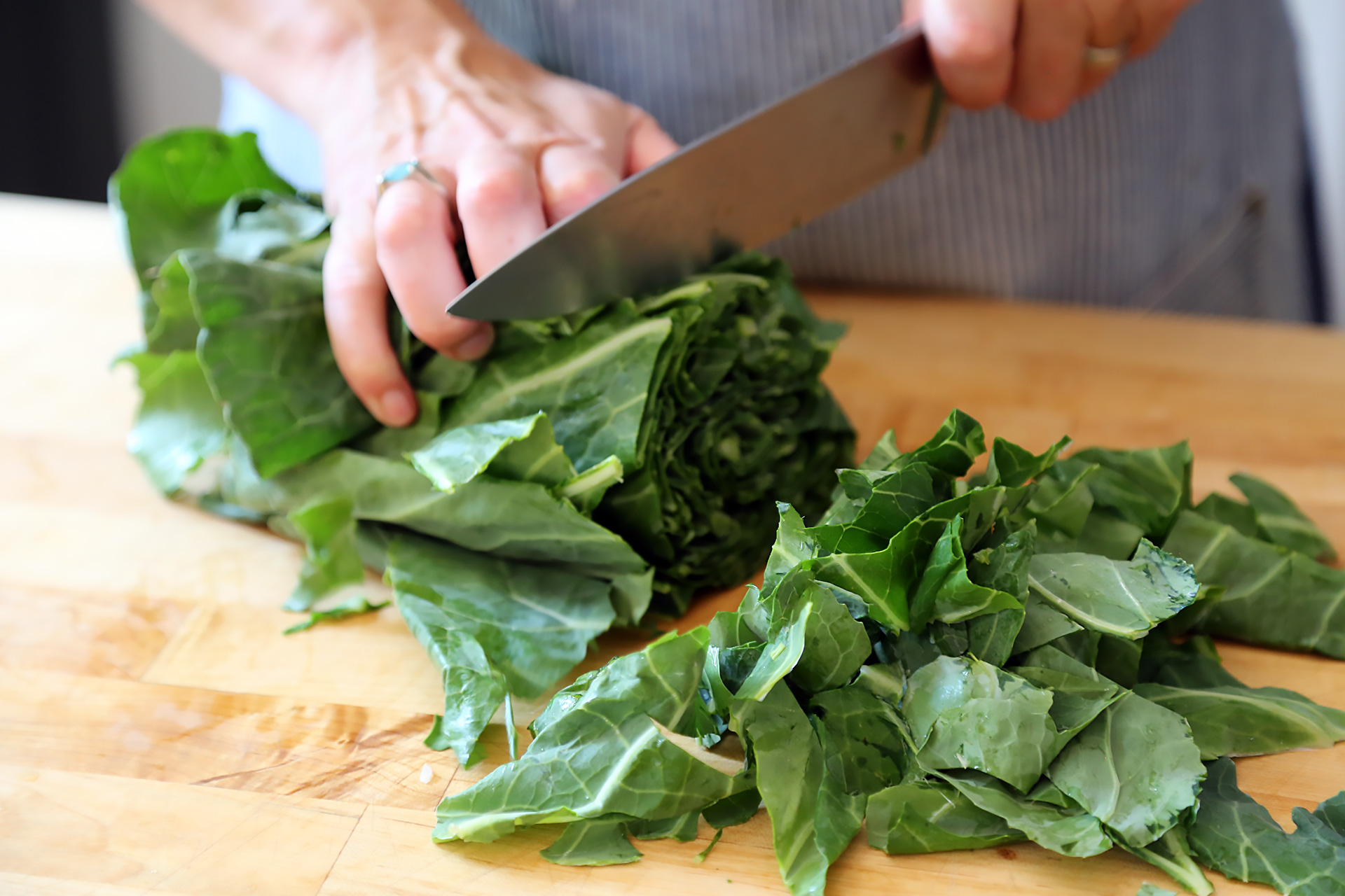 Slice the bunched greens.