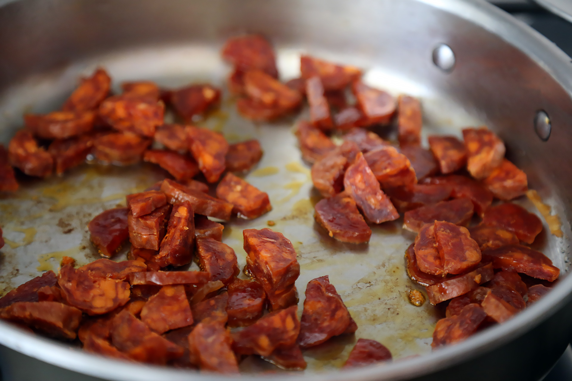 Add the chorizo, reduce the heat to medium-low and cook until lightly browned, about 3 minutes.