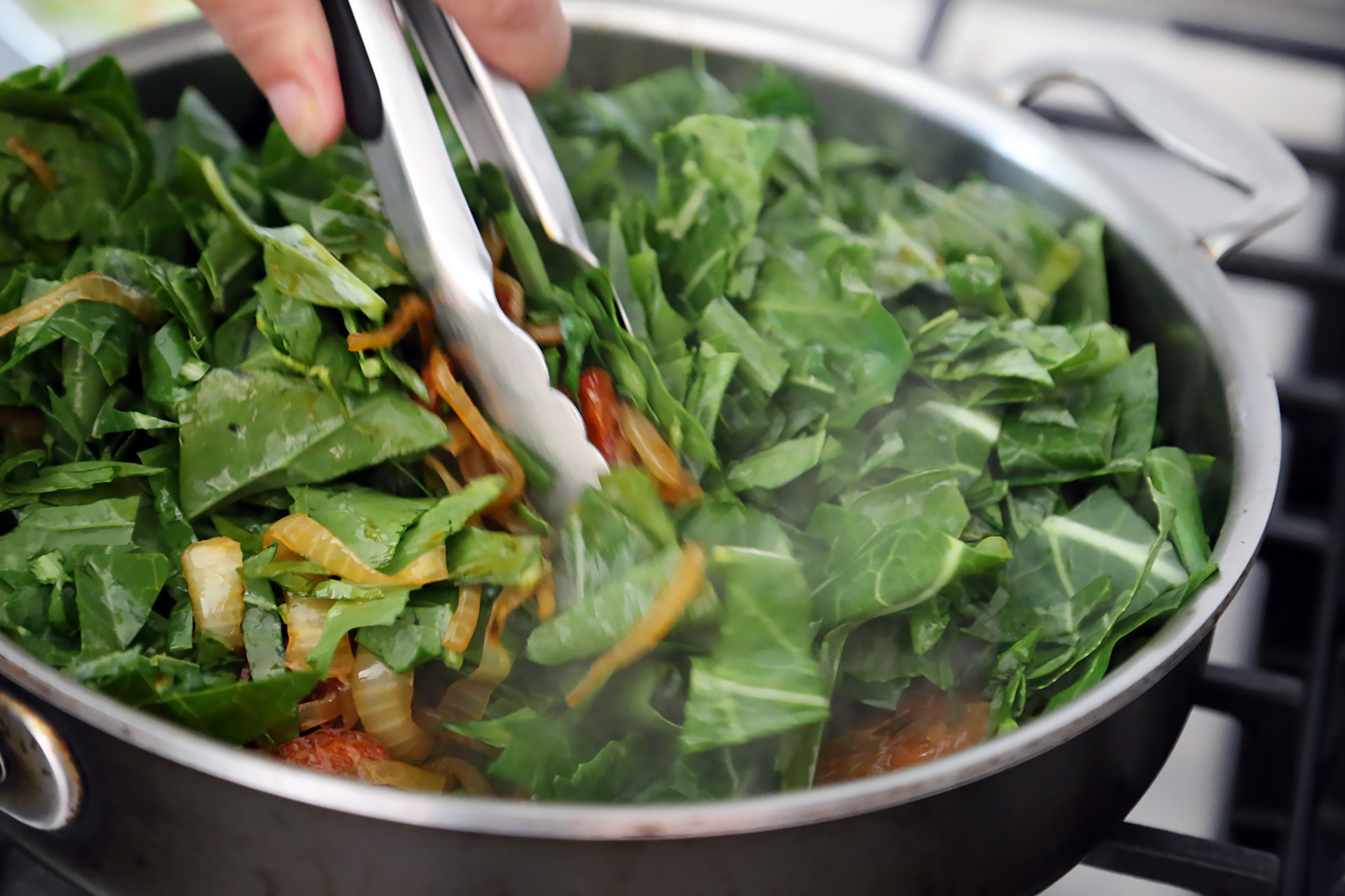 Add the caramelized onions and greens to the pan with the chorizo and stir well to combine.
