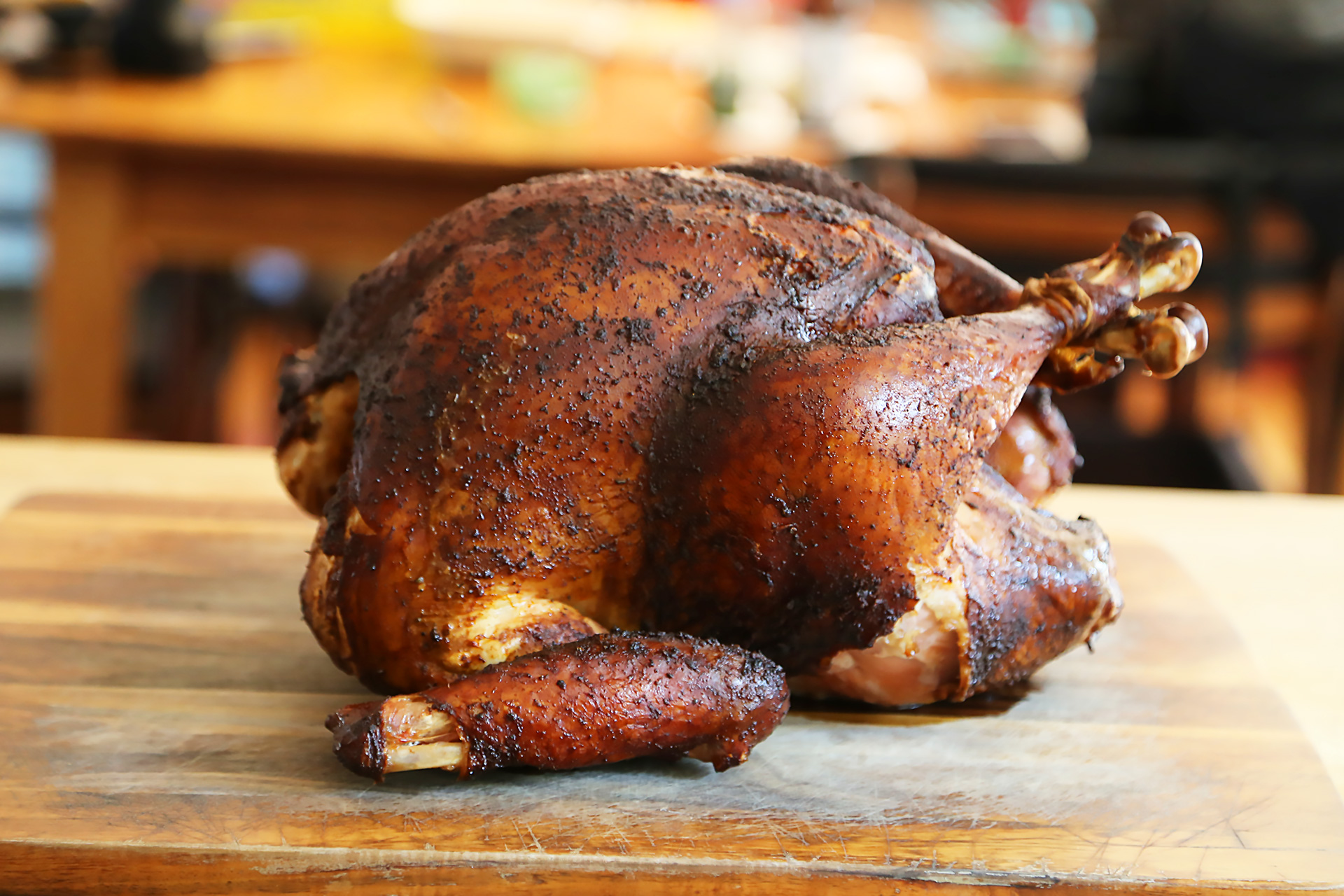 Remove the turkey from the grill and transfer to a large platter. Let rest for about 15 minutes.