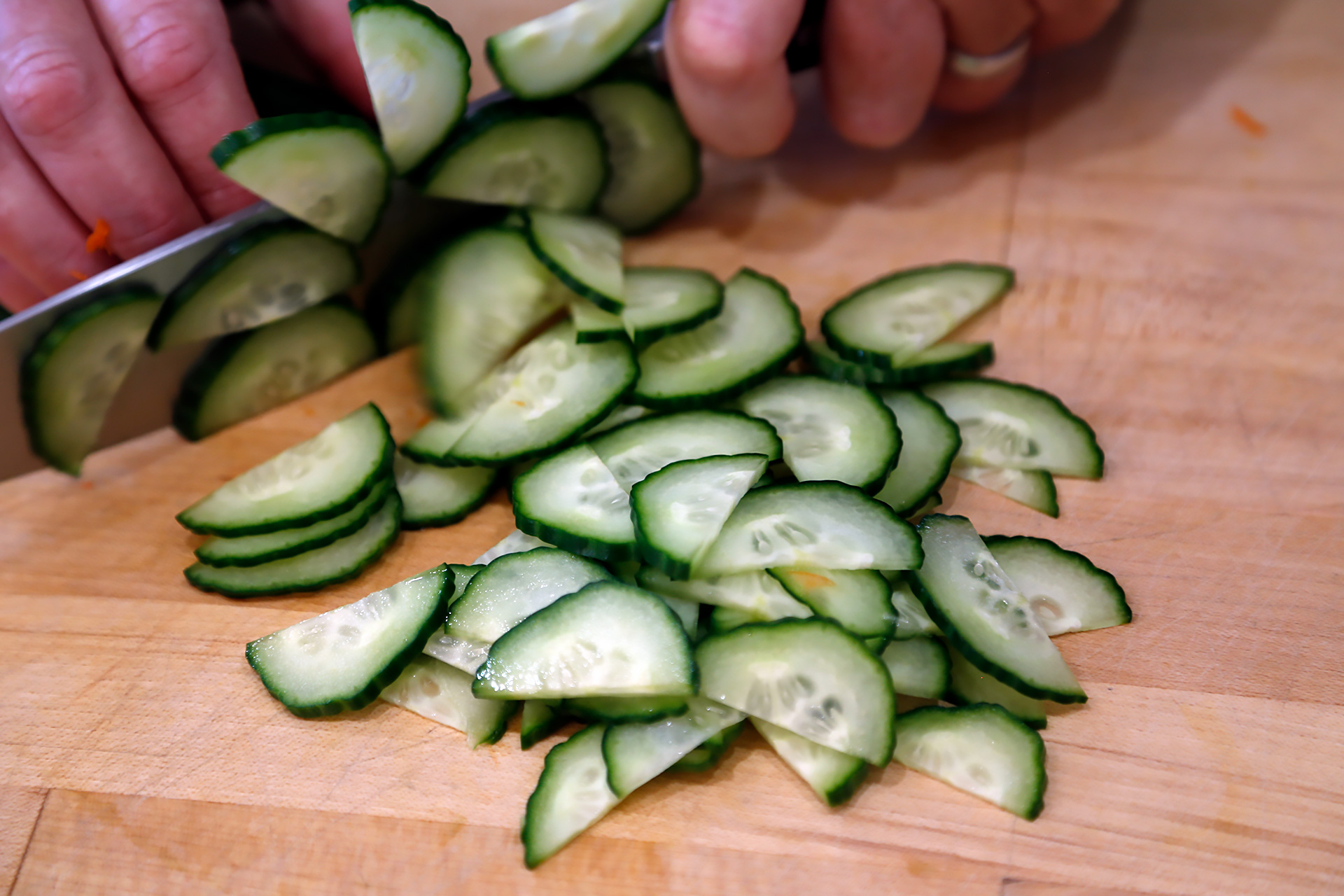 Cut the cucumber in half lengthwise then use a small metal spoon to scoop out the seeds. Thinly slice crosswise, then add to the bowl with the noodles.