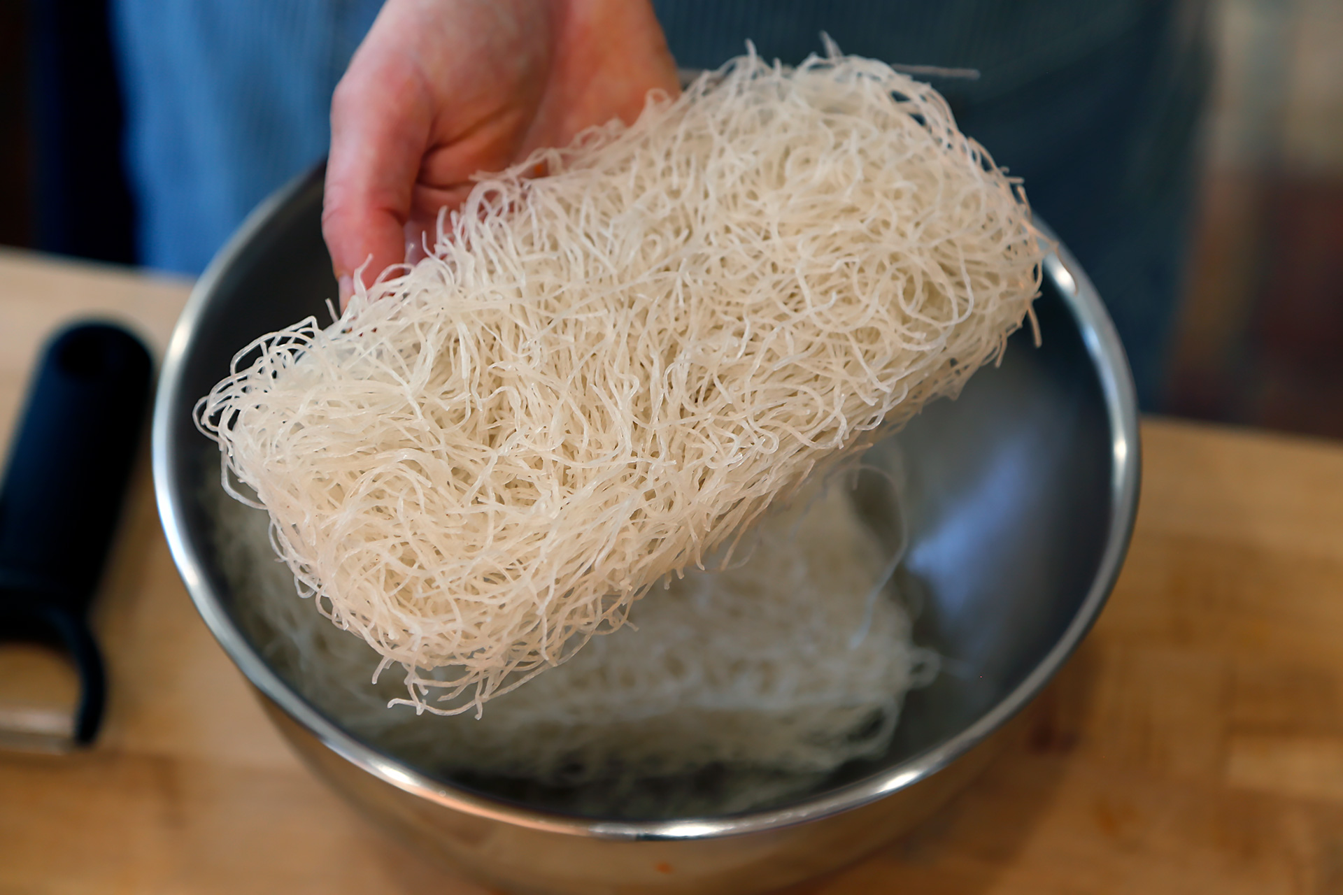 Cook the noodles according to package directions. Drain in a colander, rinsing well with cold water. Drain well again.