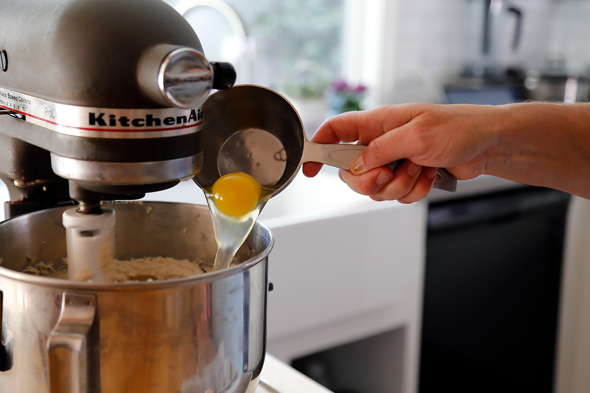 Beat in the eggs one at a time, scraping down the sides of the bowl.