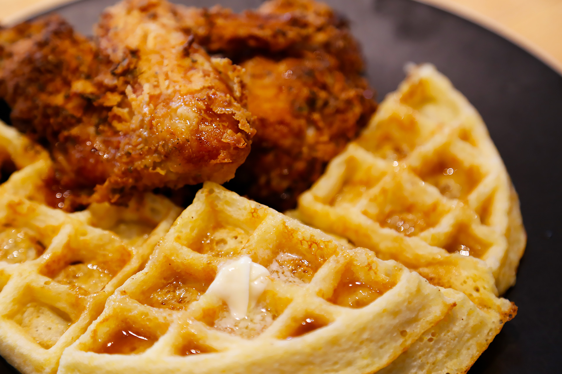 Serve Buttermilk Fried Chicken with Cornmeal Waffles and Apple Cider Syrup.