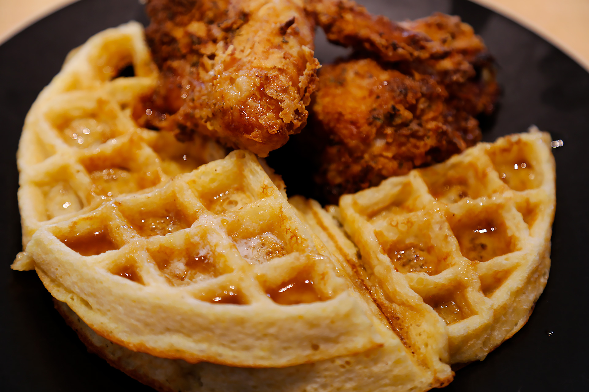 Serve cornmeal waffles with apple cider syrup and buttermilk fried chicken