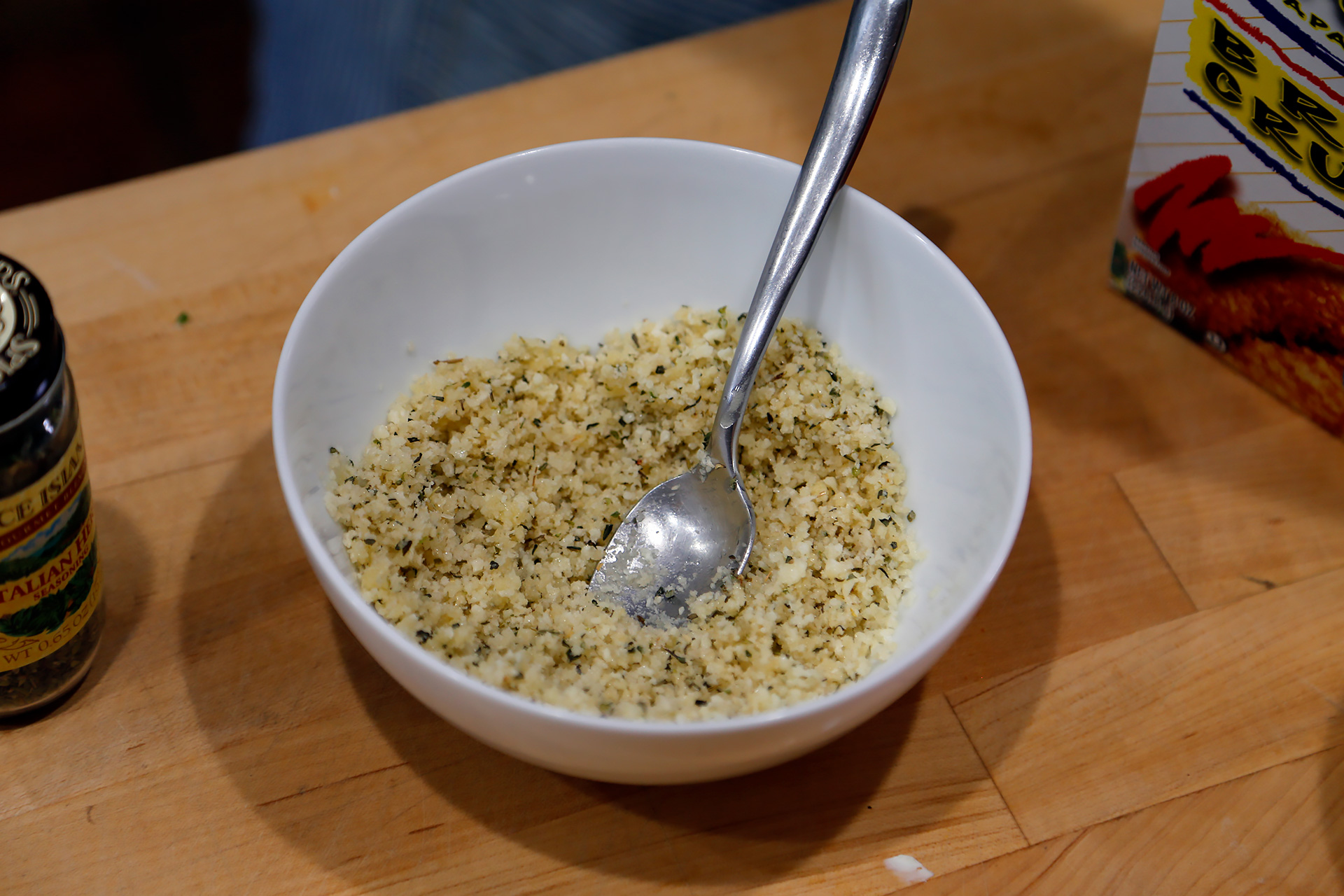 Melt the remaining 1 tbsp butter. In a bowl, stir together the remaining 1/4 cup Parmesan, the panko, herb seasoning, and the melted butter. 