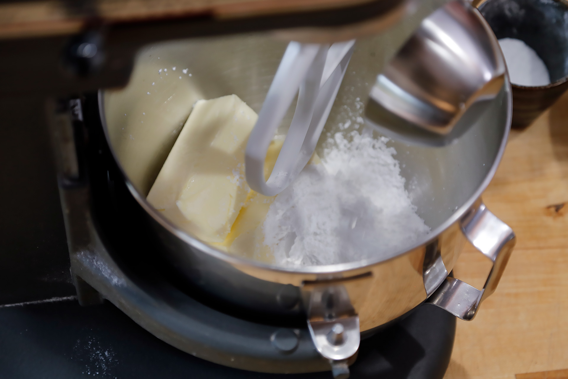 In the bowl of a mixer fitted with the paddle attachment, beat together the butter, the remaining 1/2 cup sugar, and salt. 
