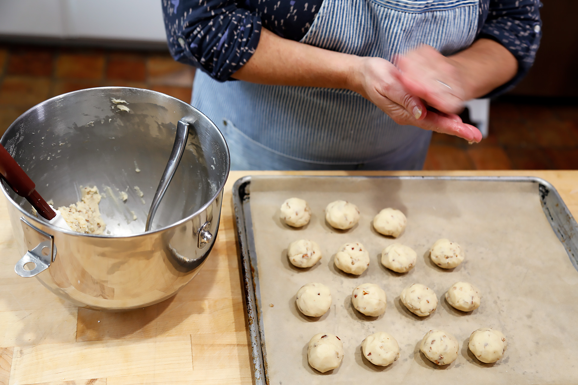 Scoop up tablespoonfuls of the dough and, using wet hands, roll into balls.