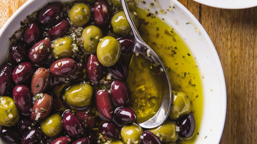 Several varieties of marinated olives.