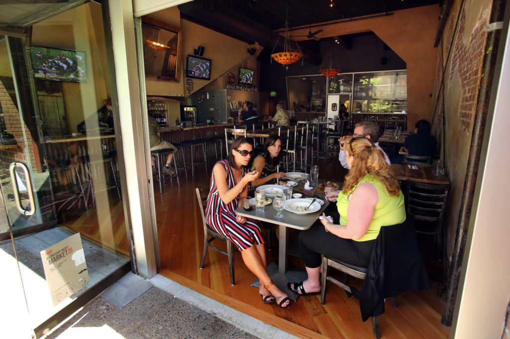 Diners enjoy lunch at the Belly Left Coast Kitchen & Tap Room in downtown Santa Rosa. 