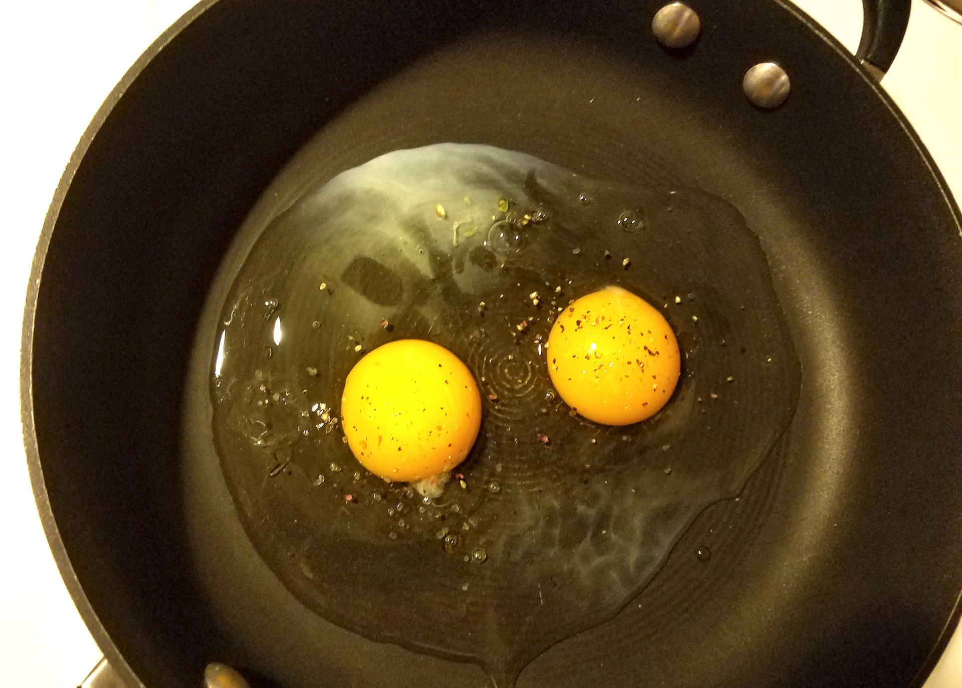Rolling Oaks' eggs in the frying pan.